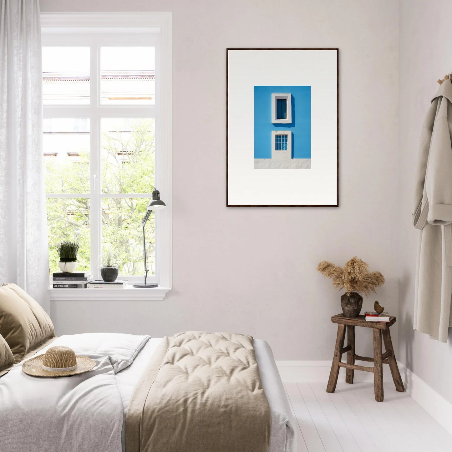 Minimalist bedroom featuring Isles Encompassed Vista framed wall art and neutral tones