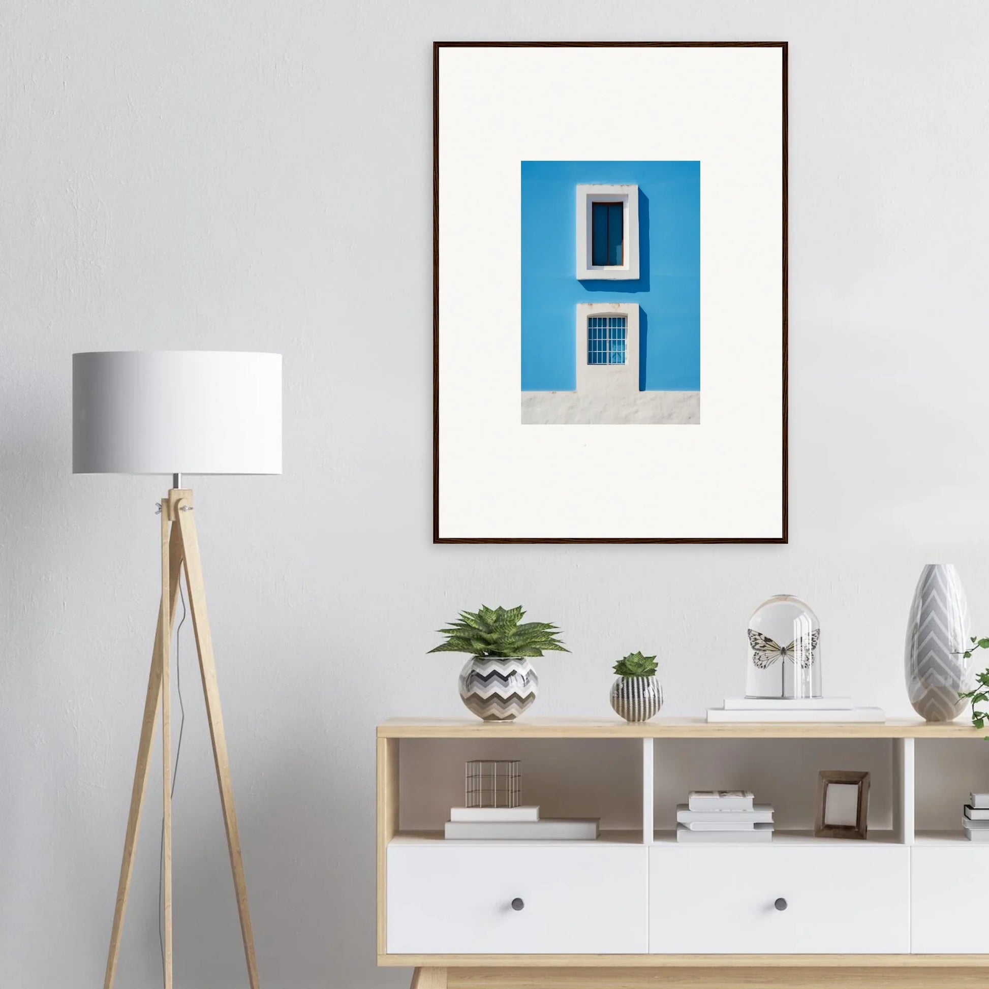 Framed wall art of a bright blue building is part of Isles Encompassed Vista collection