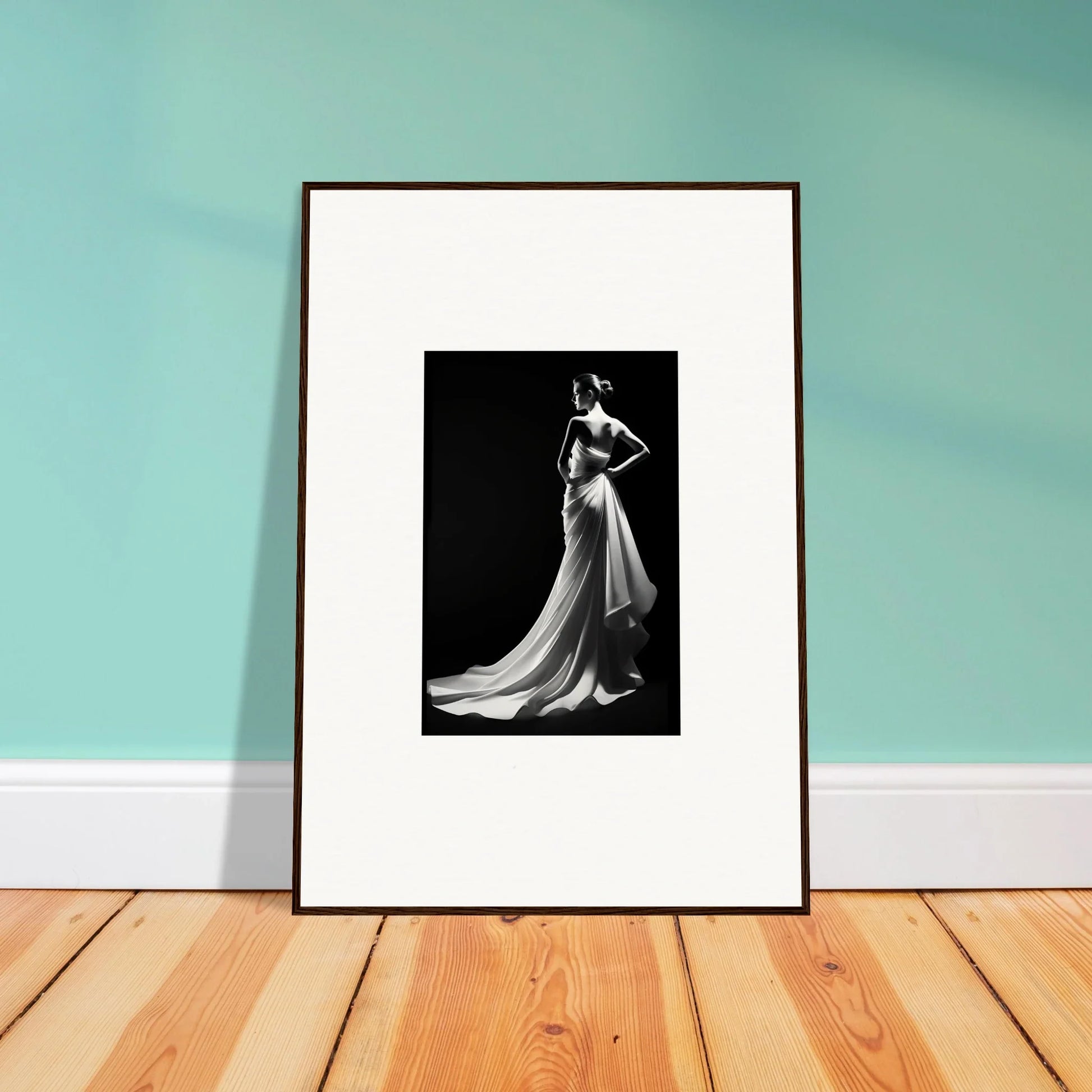 Framed black and white photo showcasing ephemeral grayscale elegance in a flowing gown