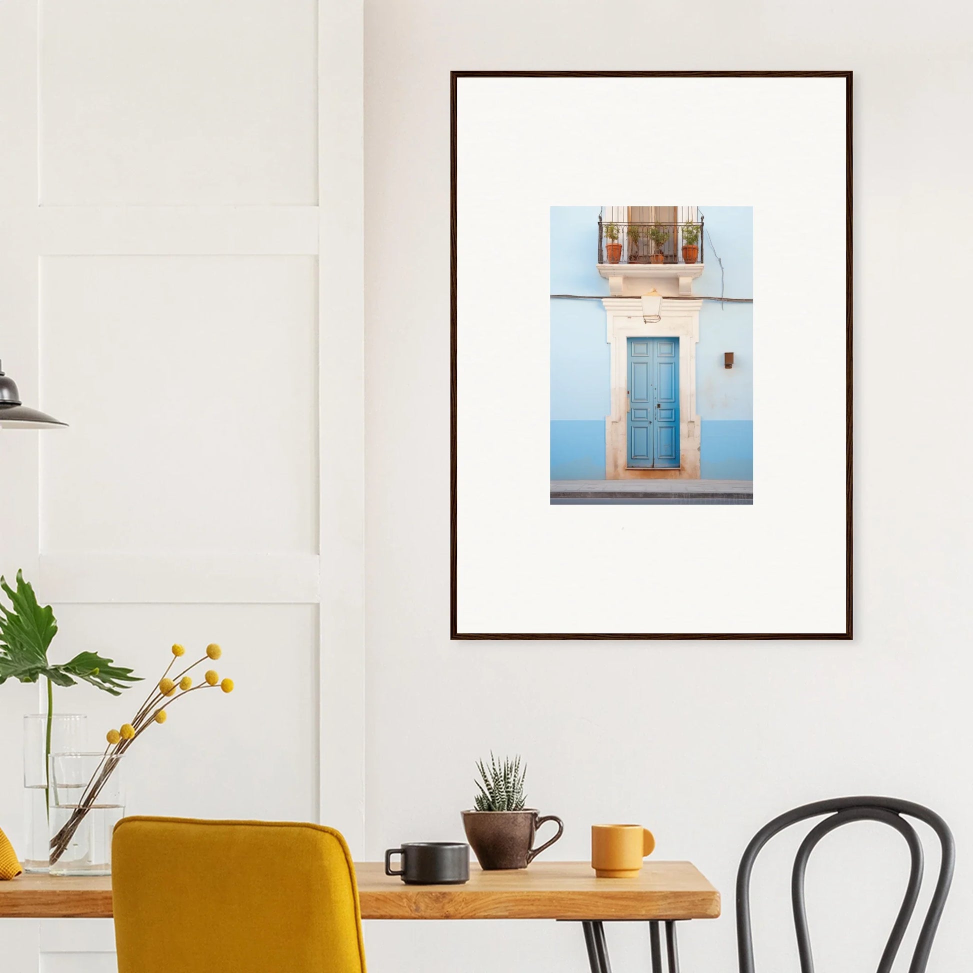 Framed wall art of an Ethereal Azul Entrance featuring a blue door in a white building