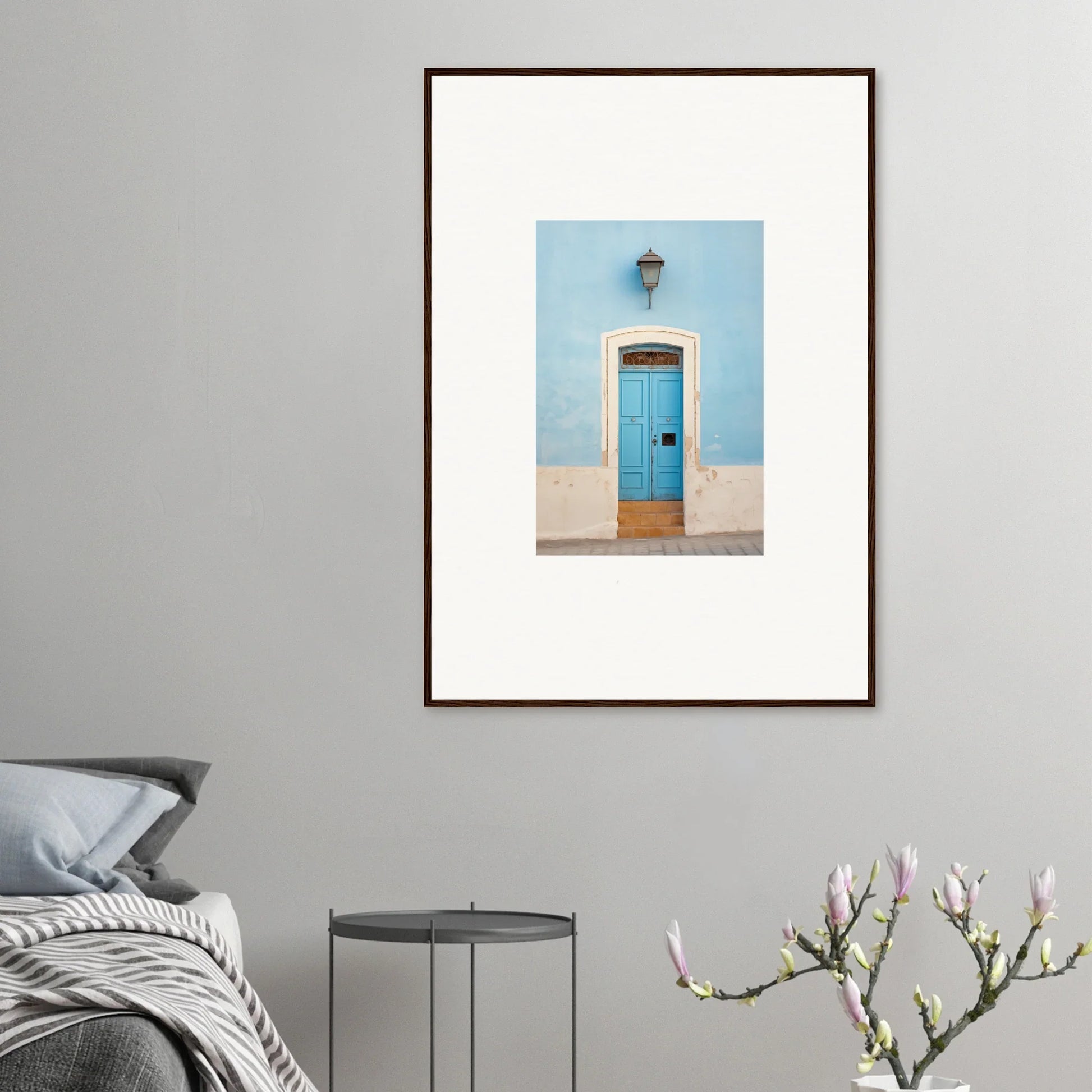 Framed wall art of a turquoise door with a pale blue wall, Surreal Azure Vesaurrezz