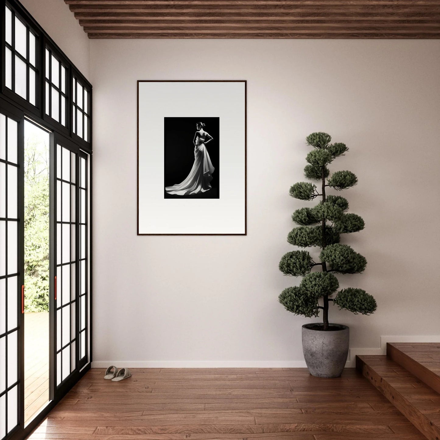 Framed black and white photo showcasing ephemeral grayscale elegance in a flowing gown