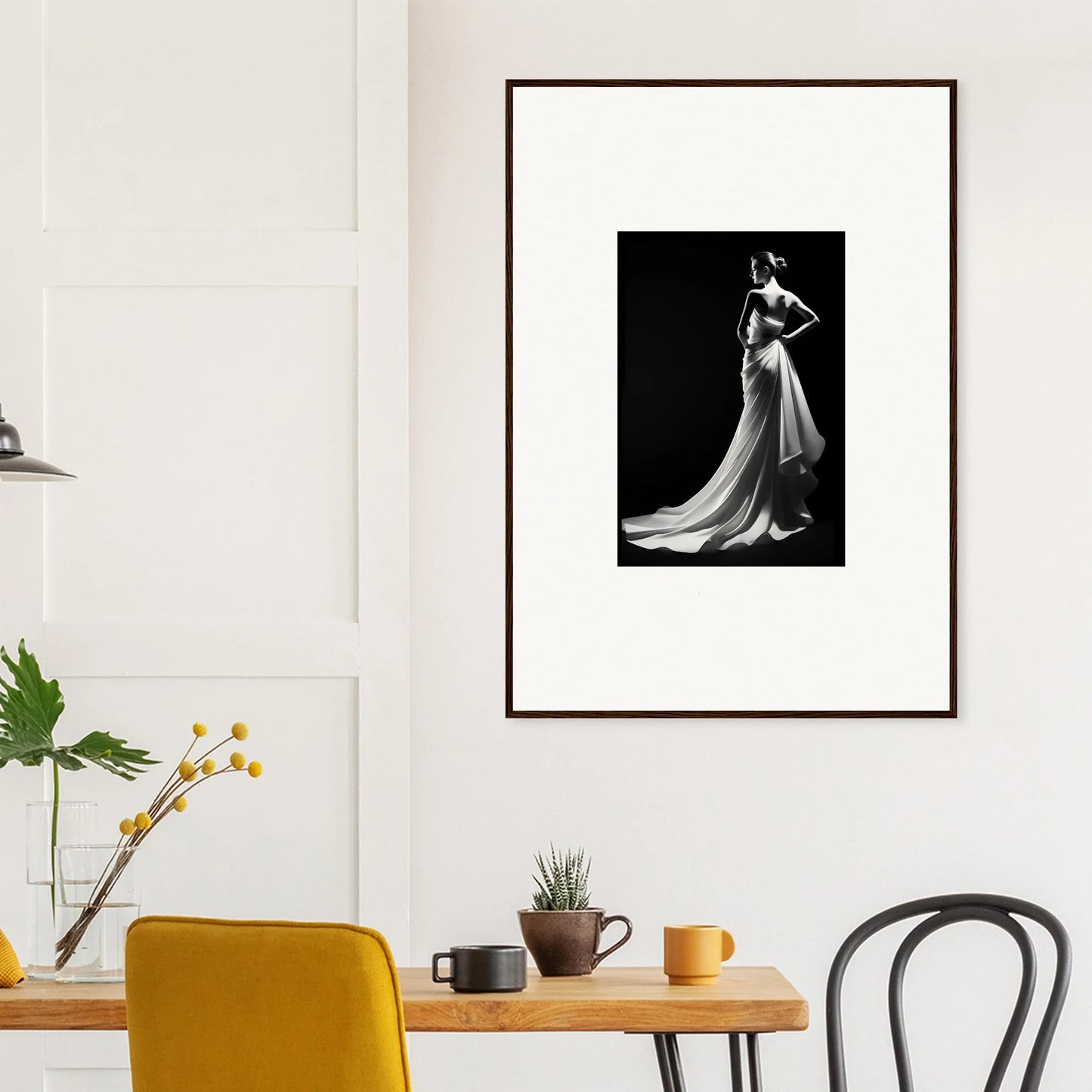 Framed black and white photo showcasing ephemeral grayscale elegance in a dramatic gown