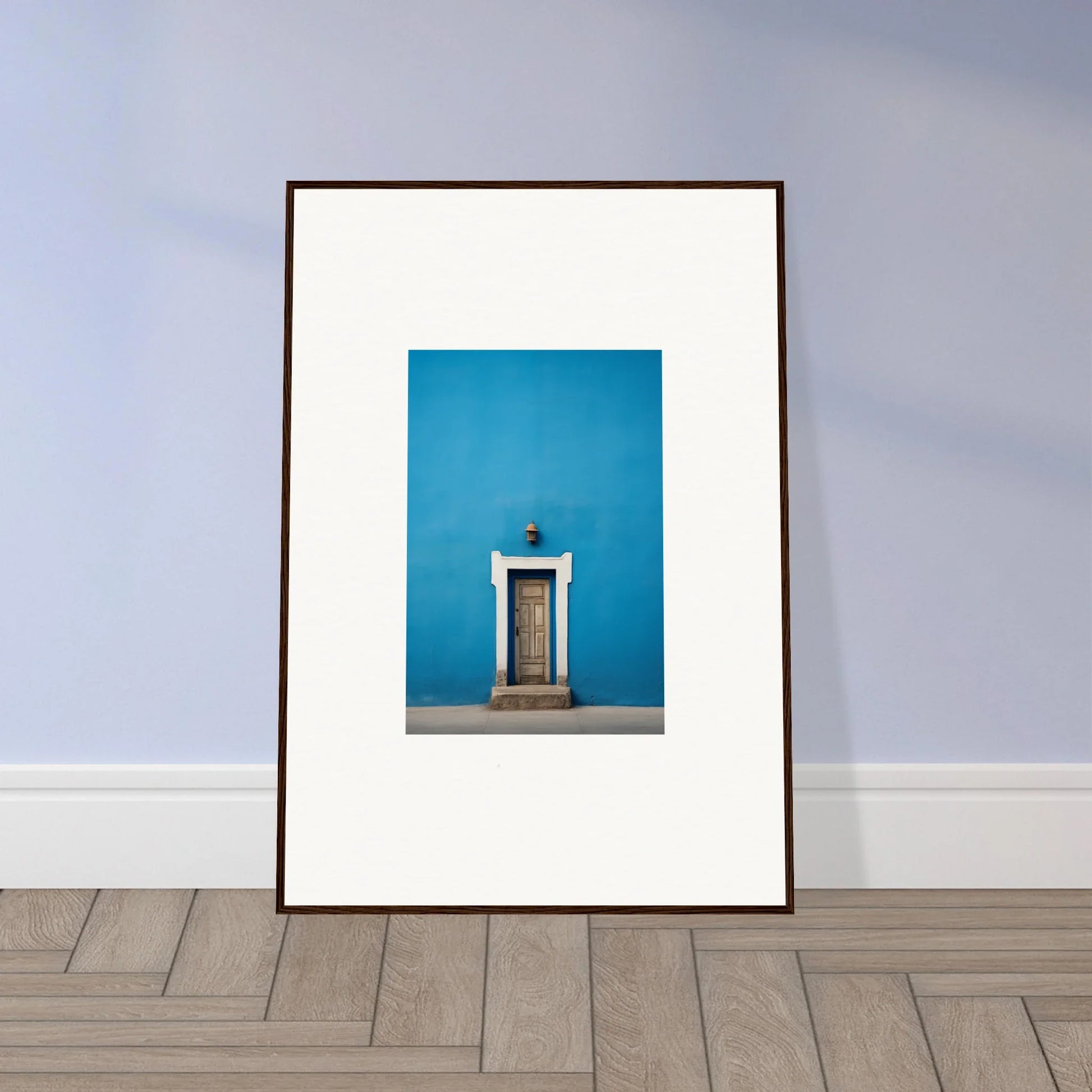 Framed photo of a white door on a bright blue wall in Eternal Cerulean Cloister art™