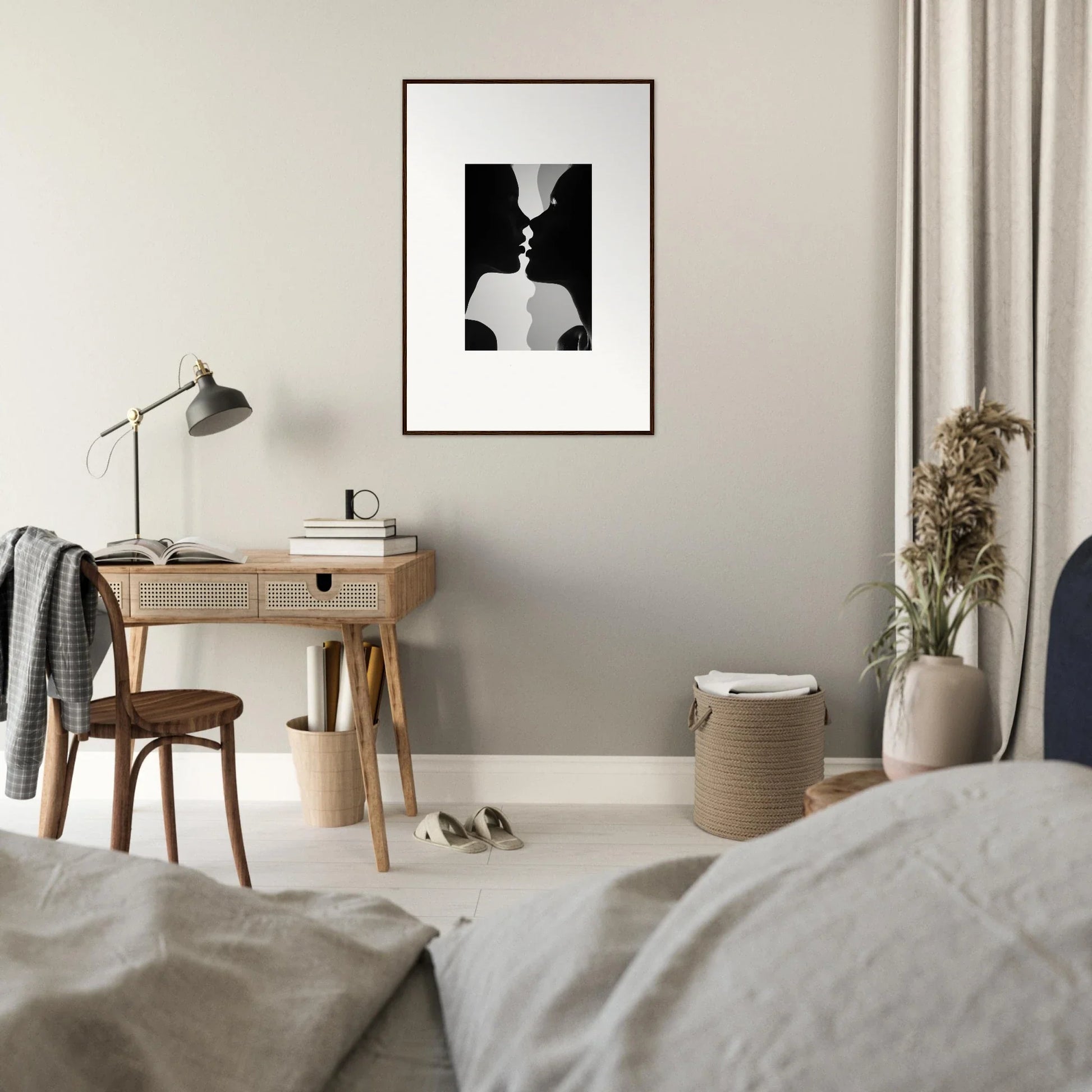 Minimalist bedroom workspace with wooden desk and lamp, featuring Nouveau Love Symphony art