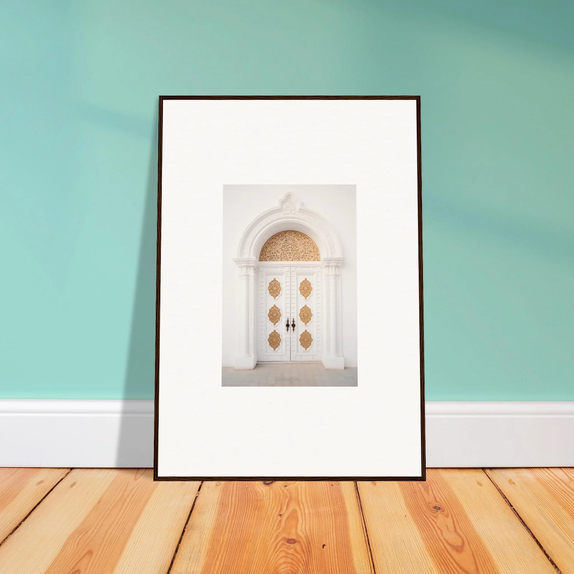 Framed wall art of an ornate white door with gold accents in Gilded Mirage Passage