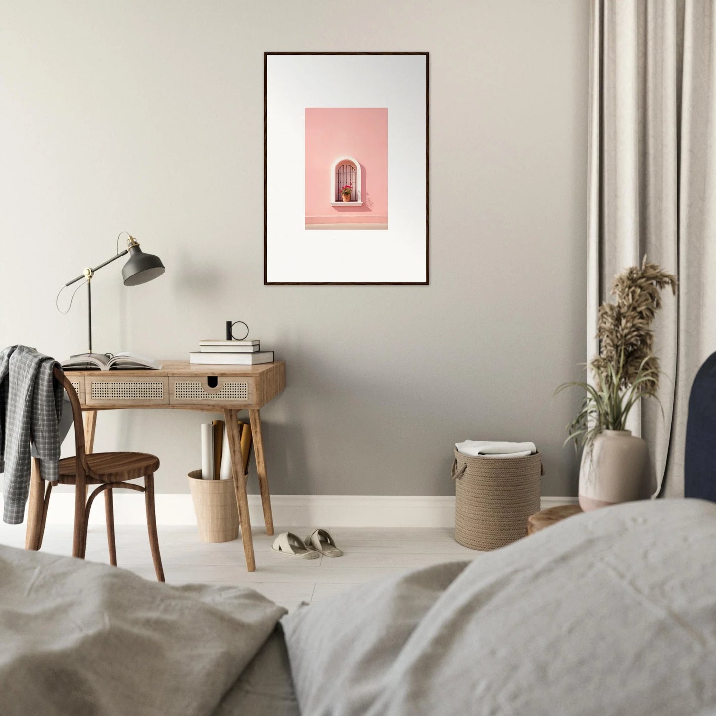 Wooden desk with a lamp and framed Sunset Silhouette Romance artwork above it