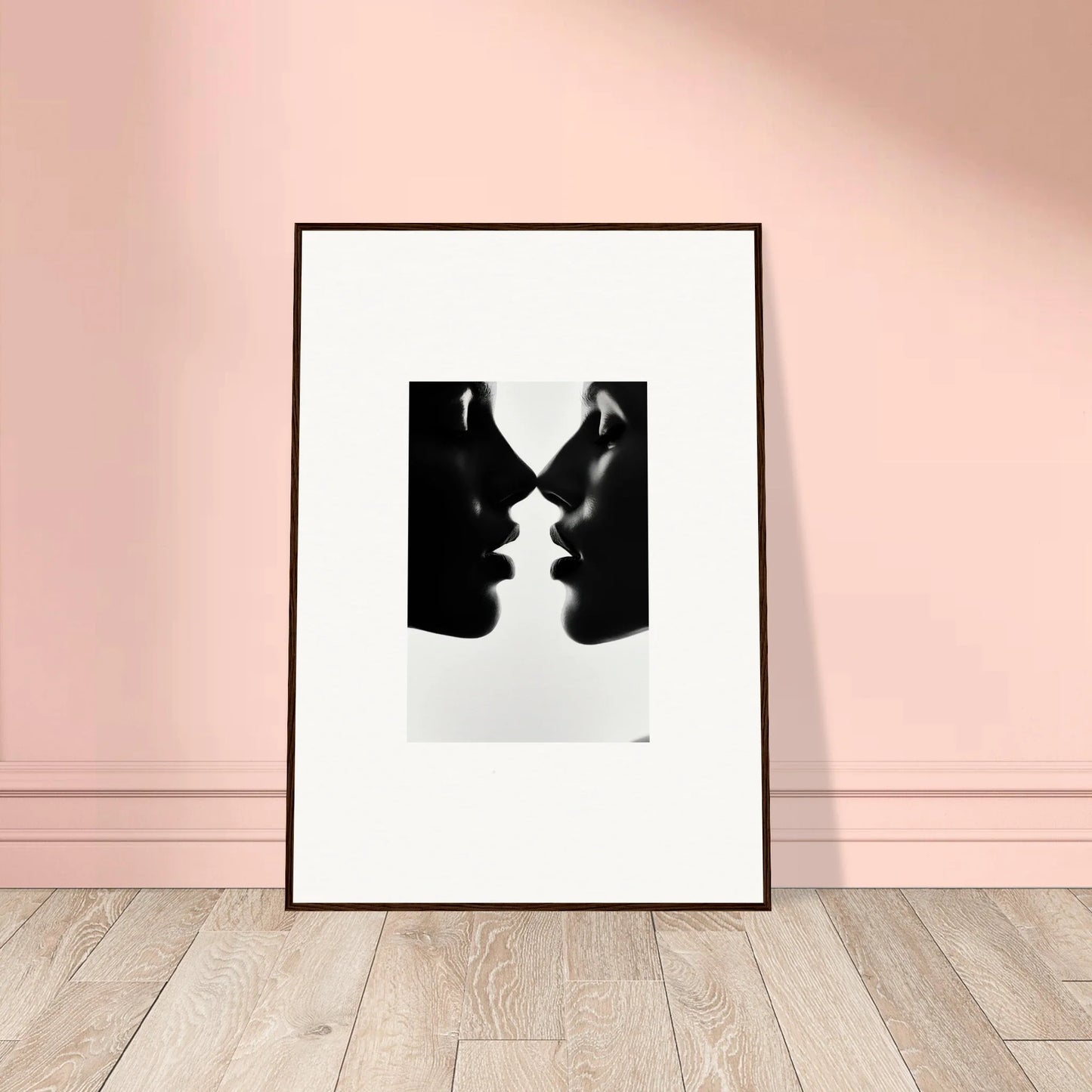 Black and white framed art print of two silhouettes from Whispers Kiss Universes