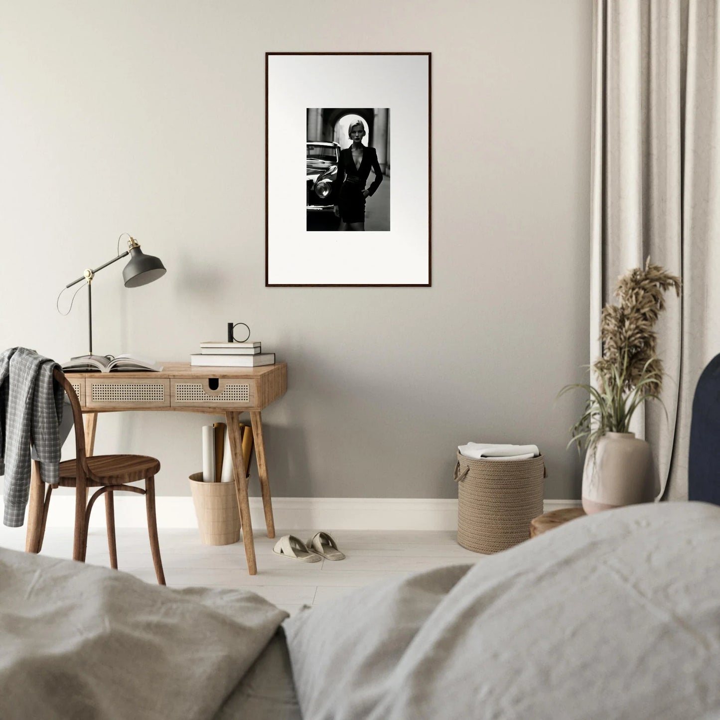 Minimalist bedroom workspace with wooden desk and Interstellar Noir Illuminations lamp