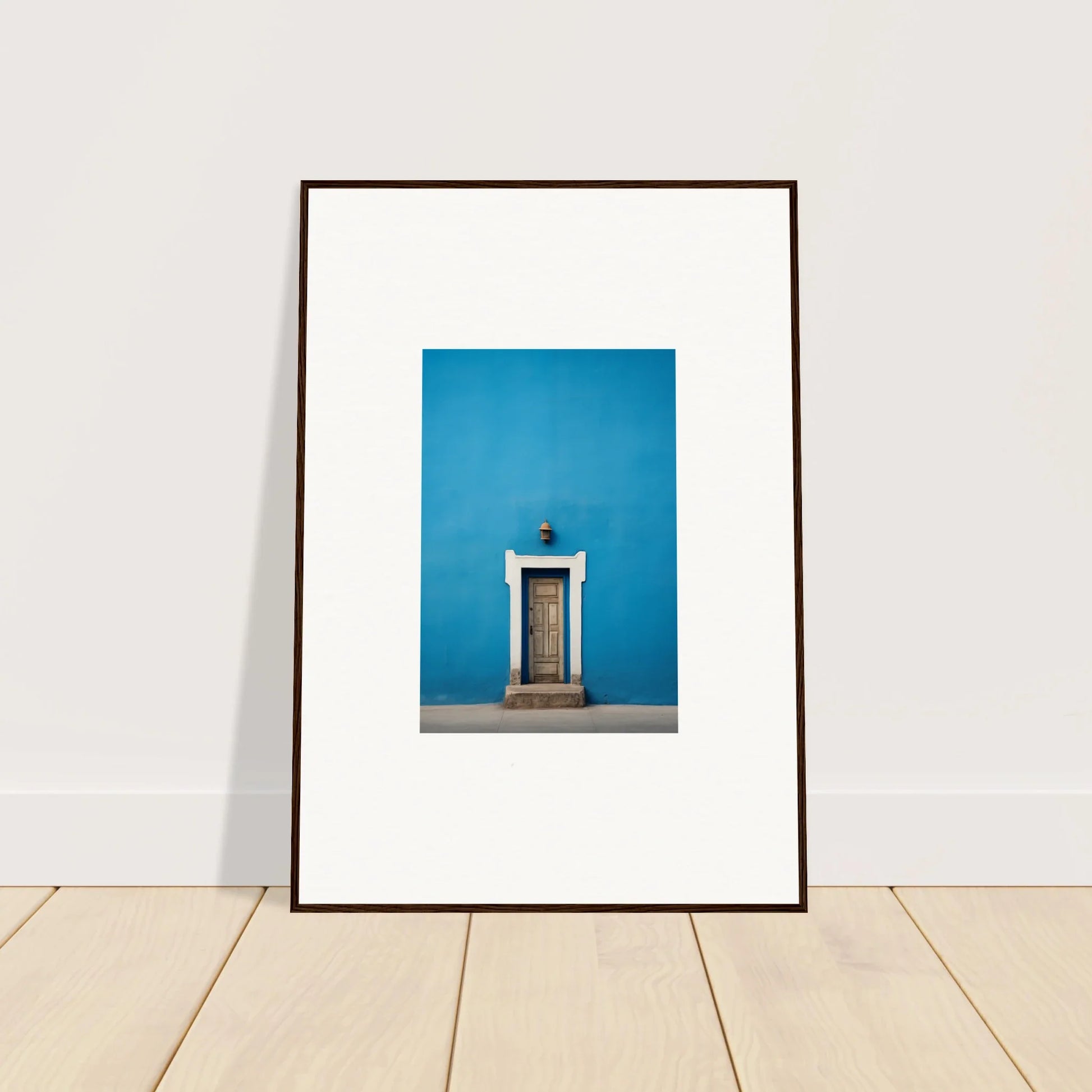 Framed photo of a white door on a bright blue wall from Eternal Cerulean Cloister