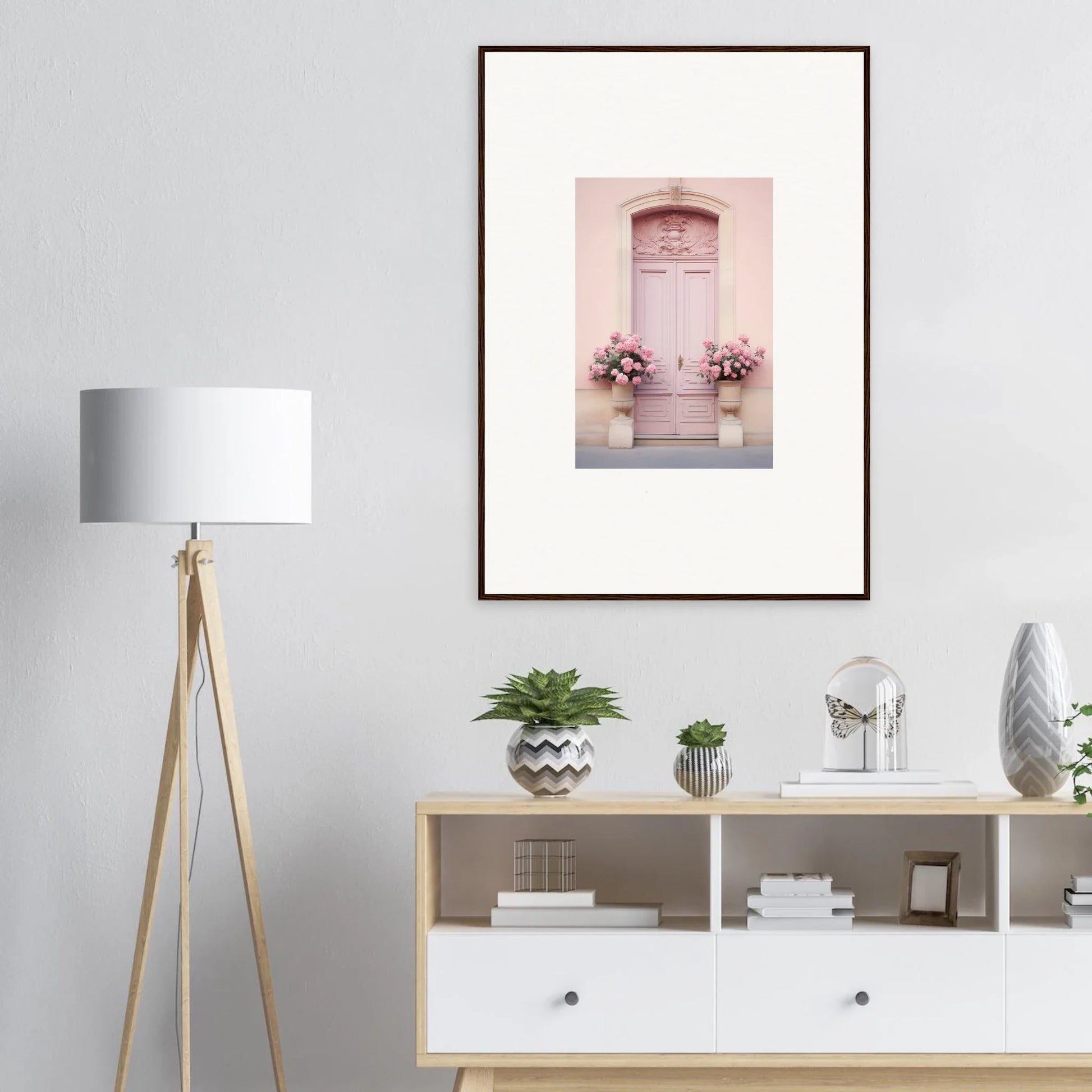 Framed wall art of a pale pink door with floral planters from Rosy Cosmos Gateway