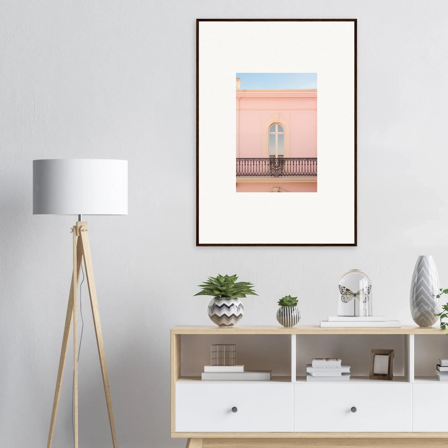 Framed wall art of a pink building and balcony under a pastel sky for Peach Tranquil Portal