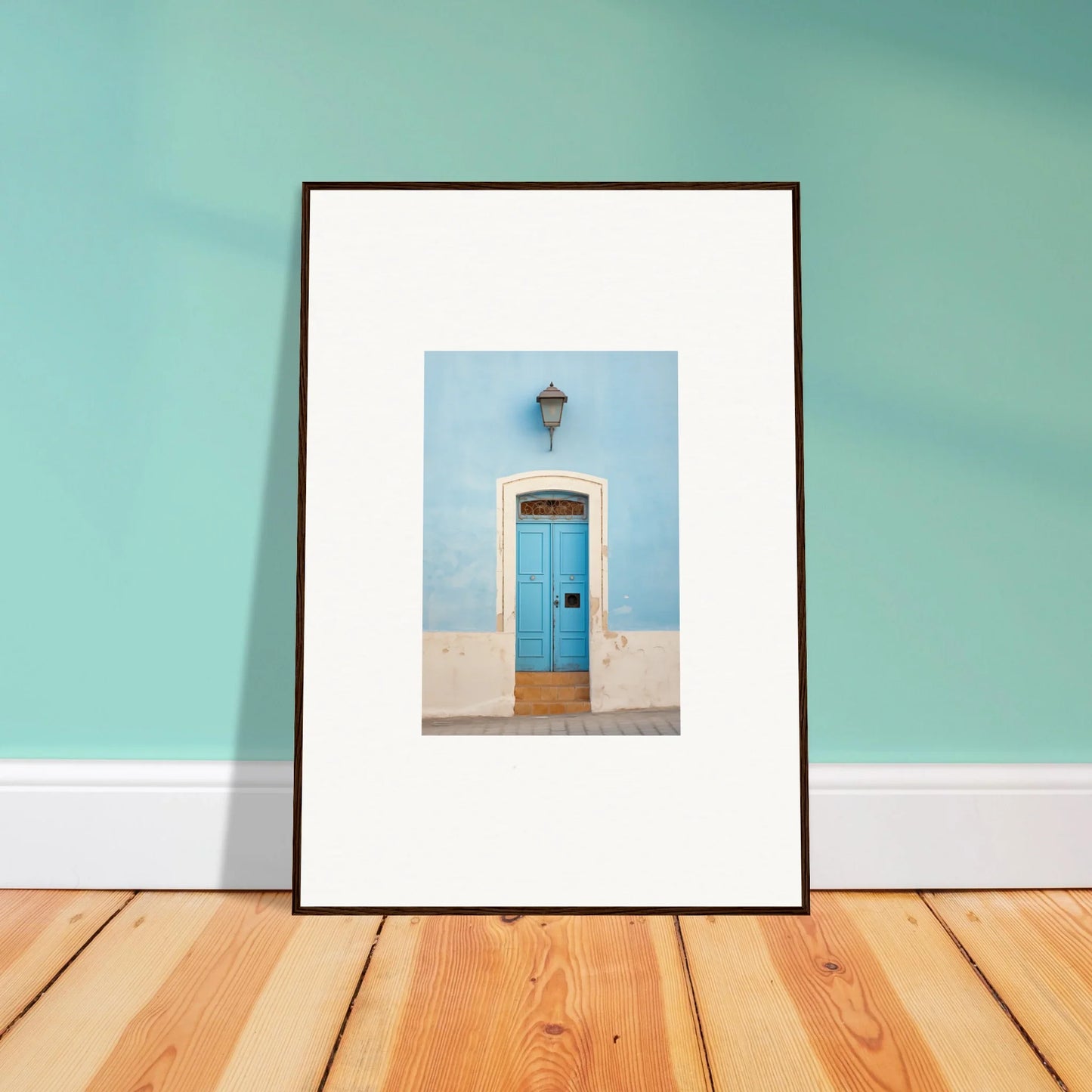 Framed wall art featuring a bright blue door on a light blue wall, Surreal Azure Vesaurrezz