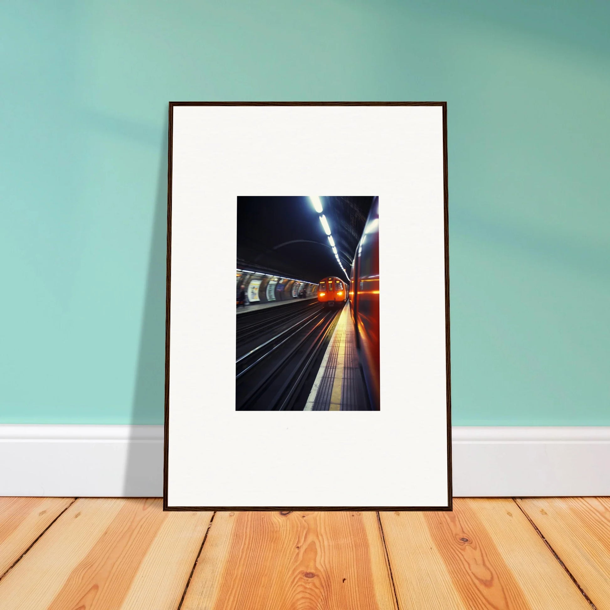 Framed photo of a lit subway station at night from Threads Passagesquent Hues special edition art™