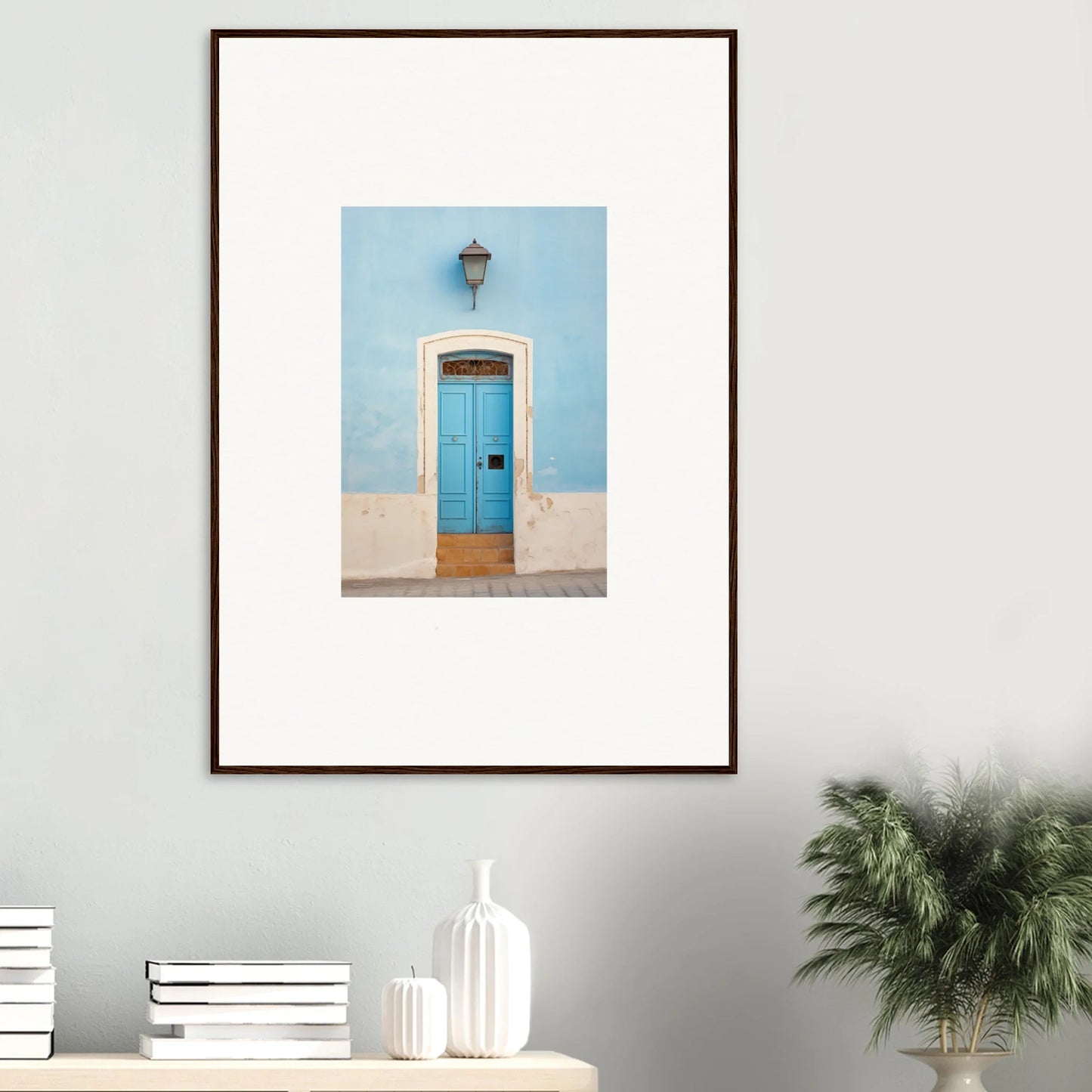 Framed wall art of a bright blue door with a lantern for Surreal Azure Vesaurrezz