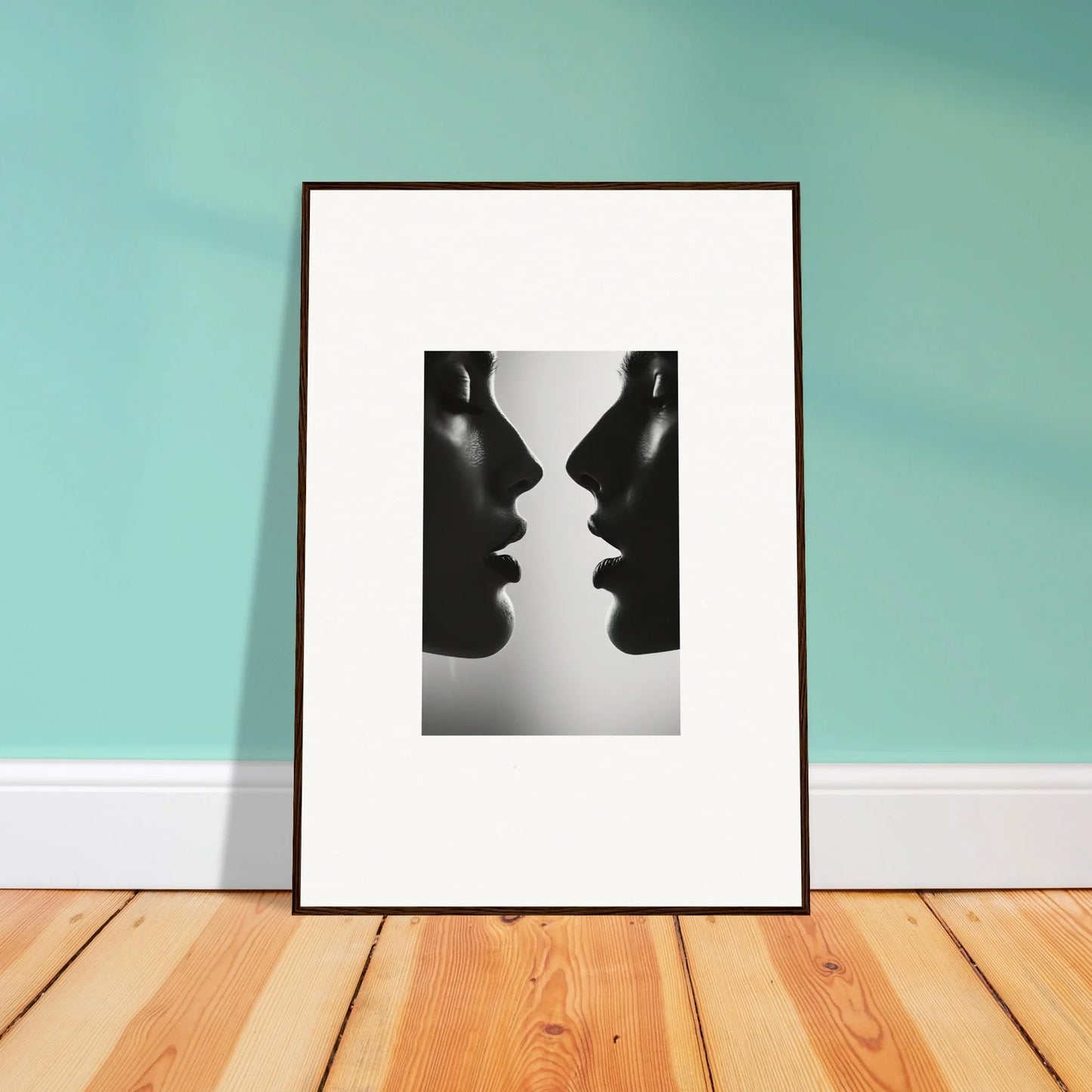 Framed black and white art of two silhouettes facing each other in Echo’s Embrace