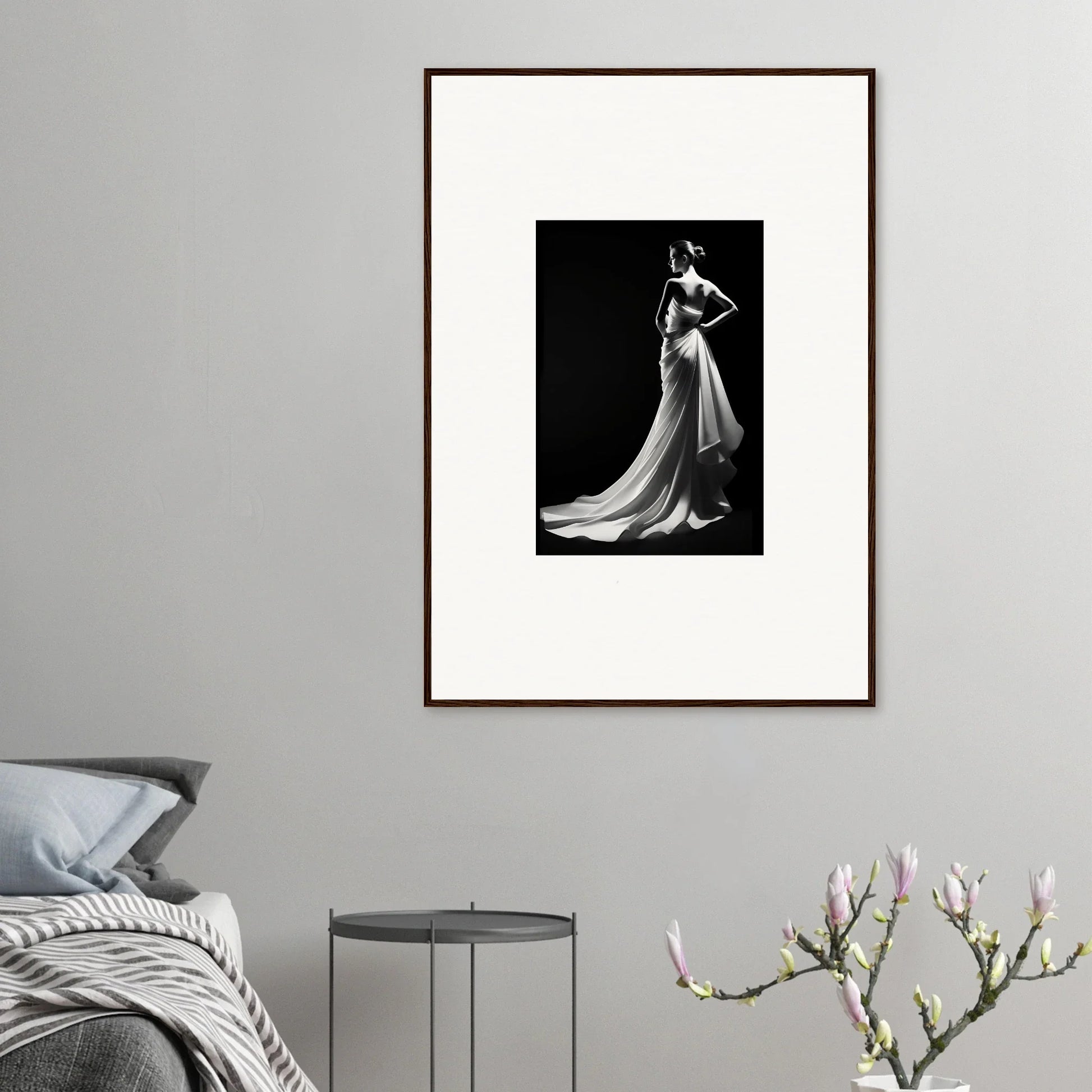 Framed black and white photo showcasing ephemeral grayscale elegance in a flowing gown