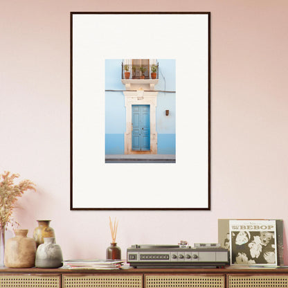 Framed wall art of an ethereal azul entrance featuring a blue door and ornate trim