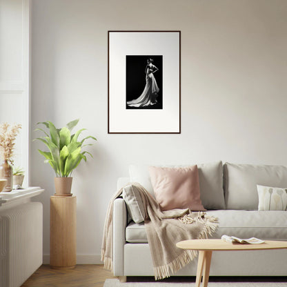 Framed black and white photo showcasing ephemeral grayscale elegance in a flowing gown