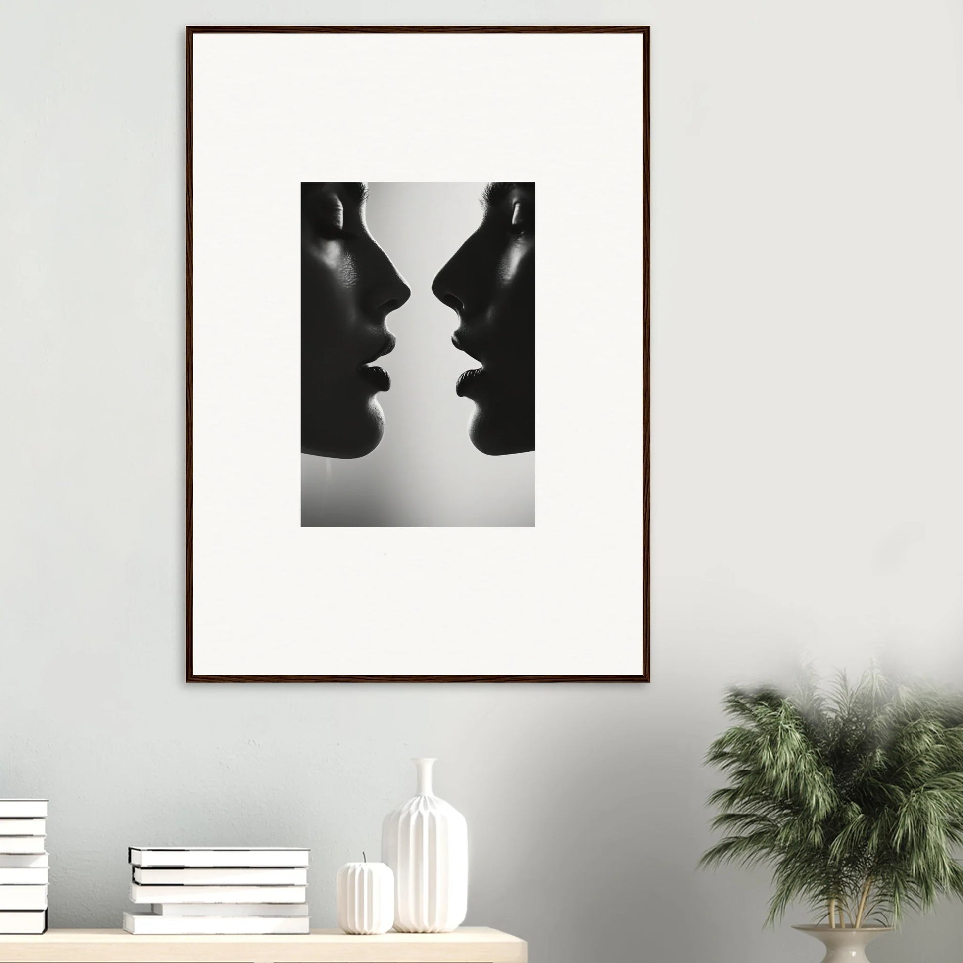 Framed black and white photo of two silhouettes titled Echo’s Embrace special edition art