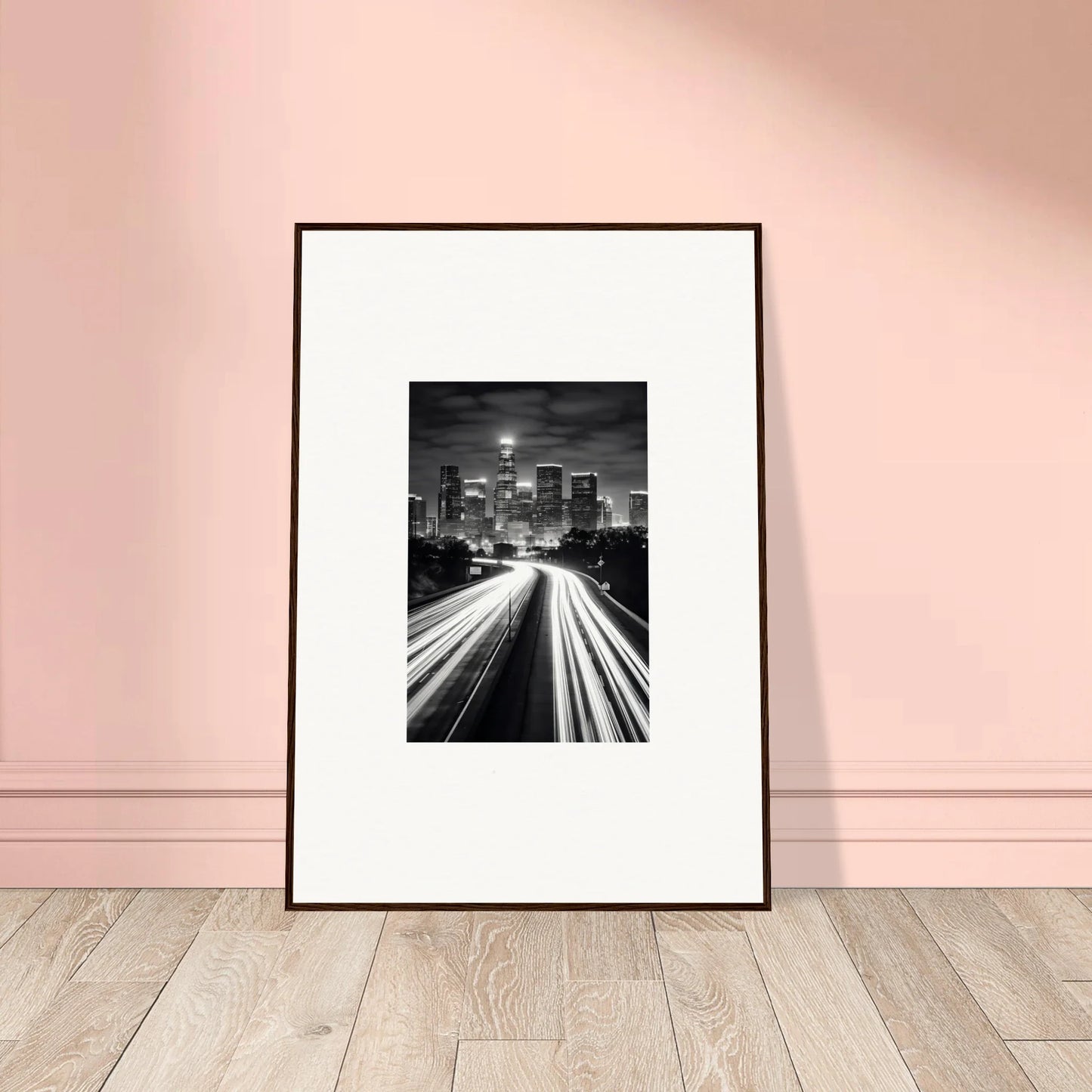 Framed wall art of a city skyline with light trails, perfect for any modern space