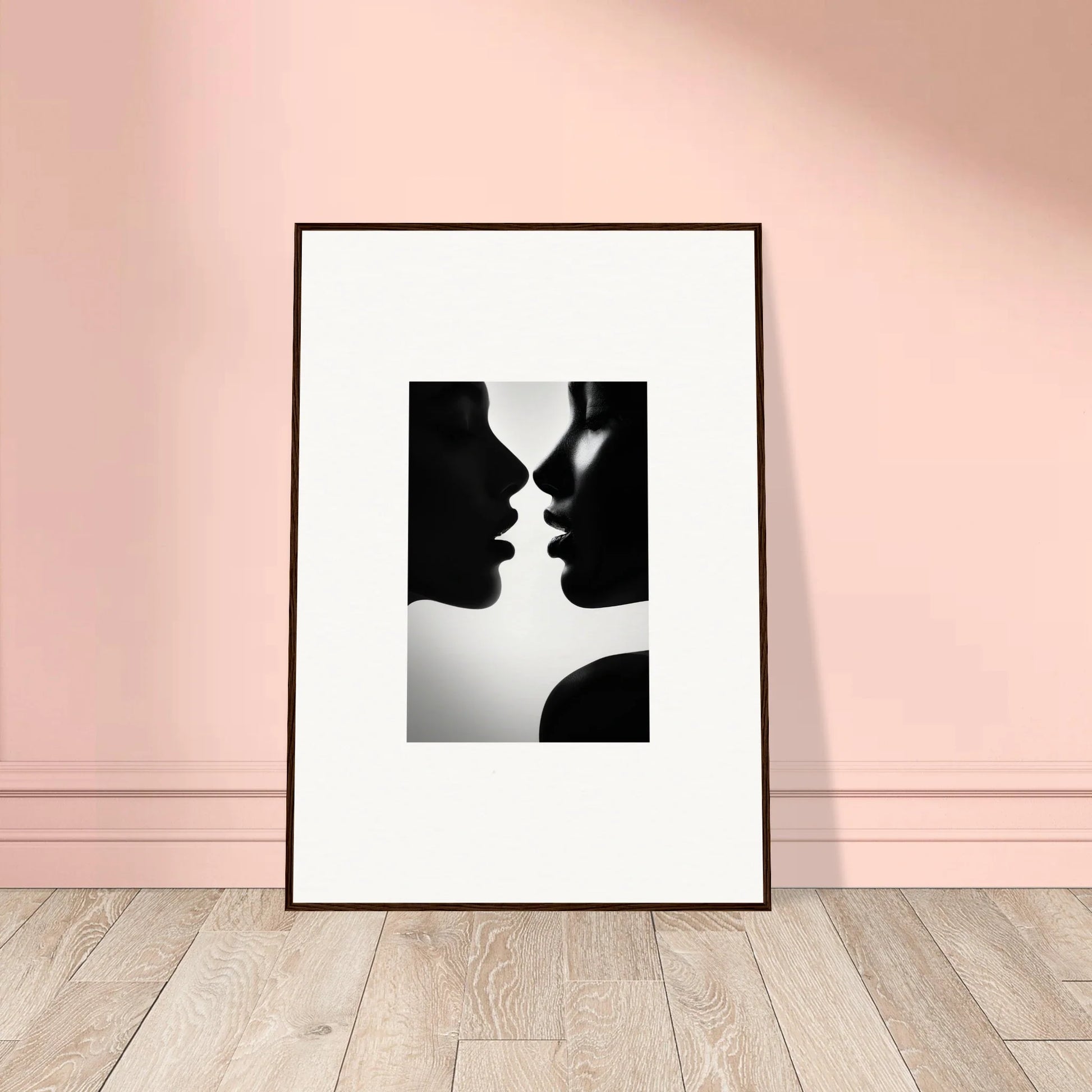 Framed black and white silhouette art of two profiles for Sables Dance special edition