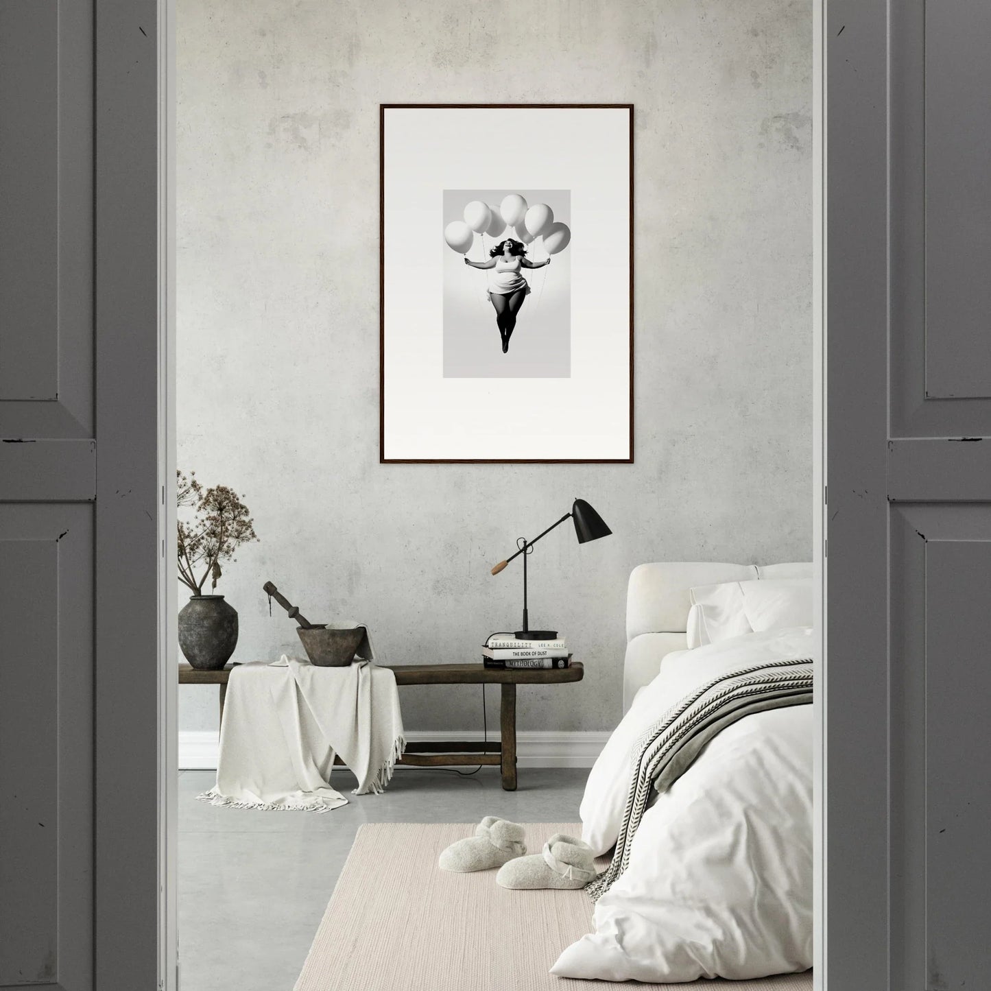 Monochromatic bedroom with Rosy Liberties Soar framed wall art on a gray wall