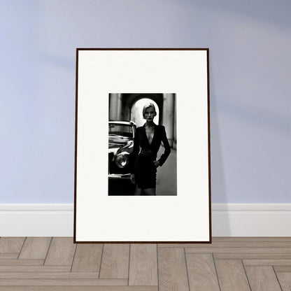 Framed black and white photo of chic figure beside vintage car from Interstellar Noir Illuminations