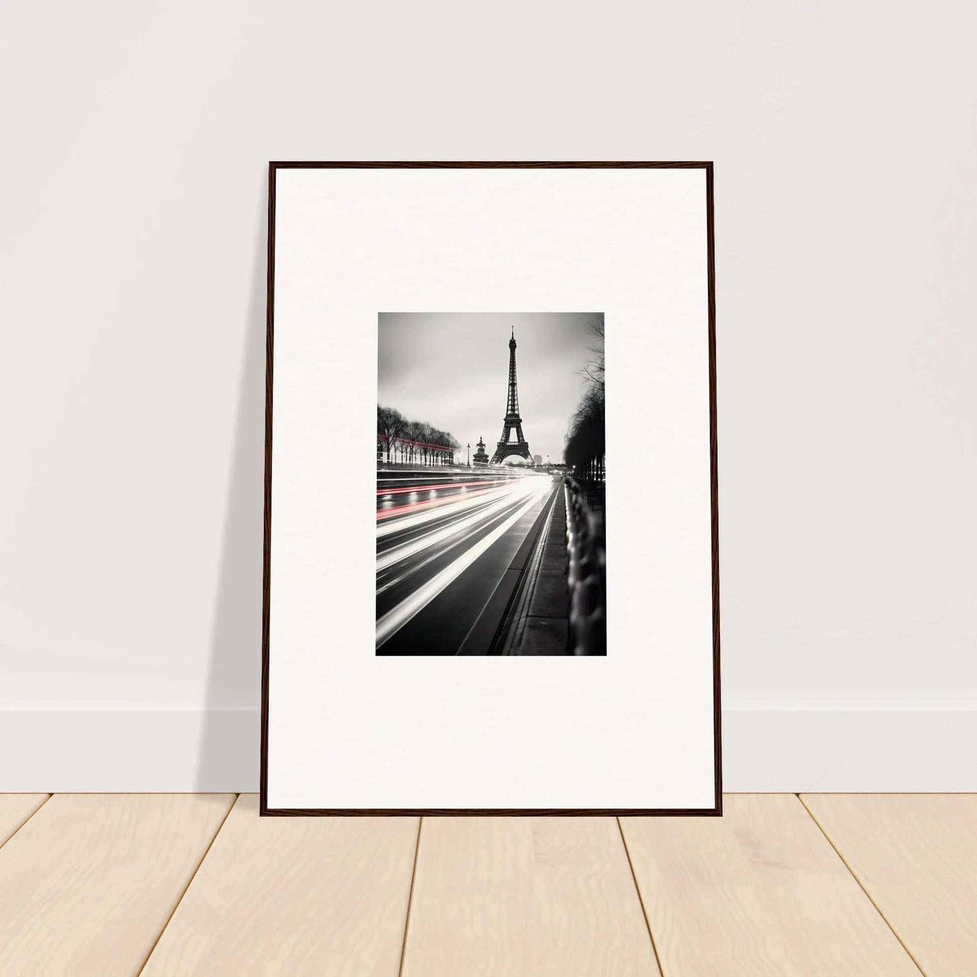 Framed black and white Eiffel Tower photo with light trails in Eternal Windsweep Halo art™