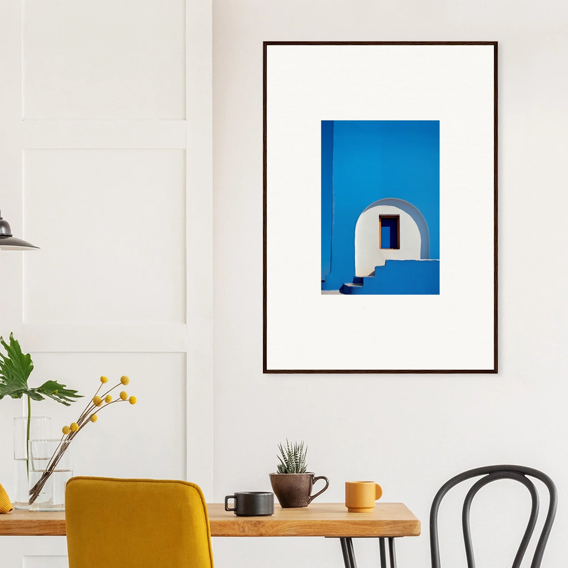 Framed wall art of a white Mediterranean archway on a blue wall, Dreams’ premium framed