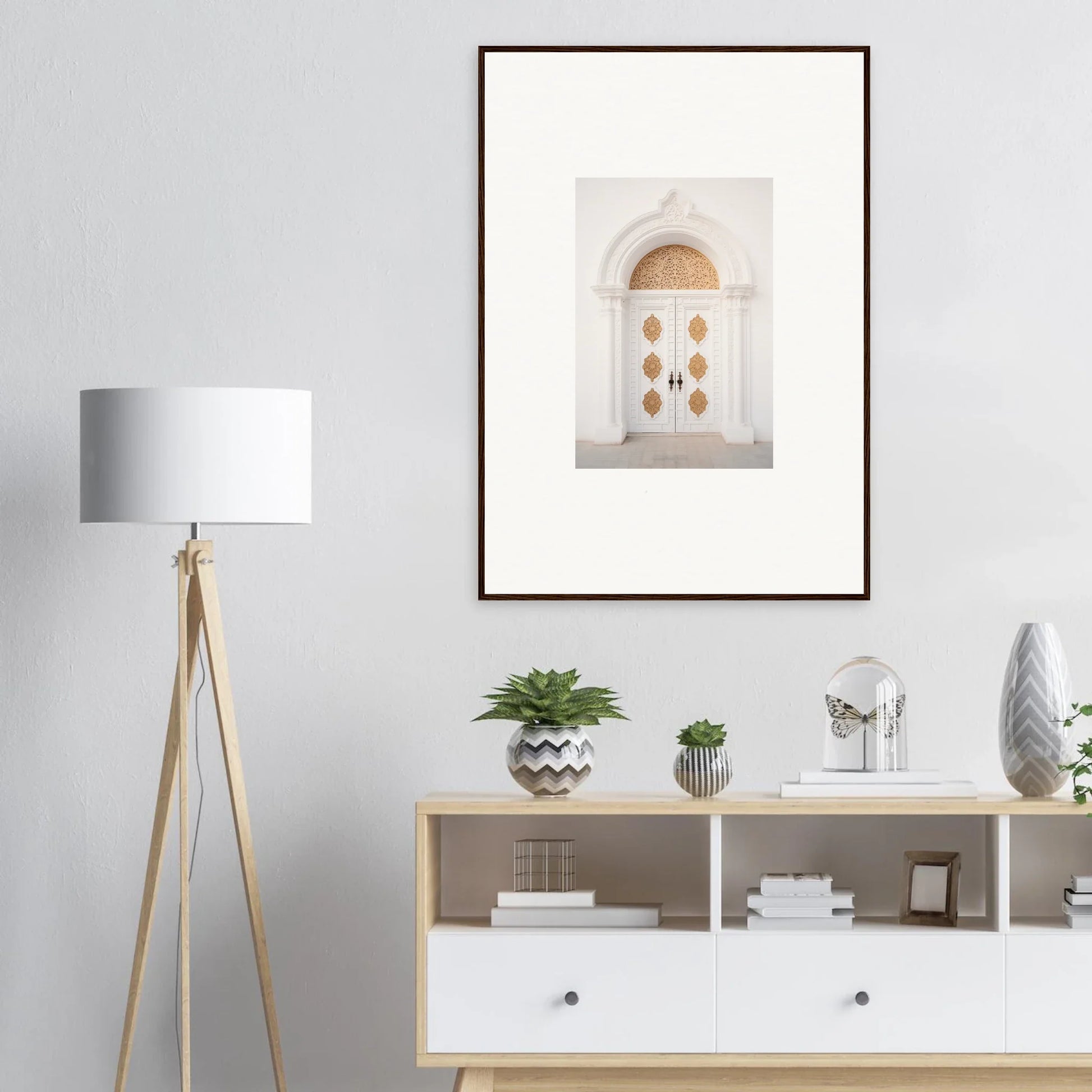 Framed wall art of a white door with brass circles in Gilded Mirage Passage design