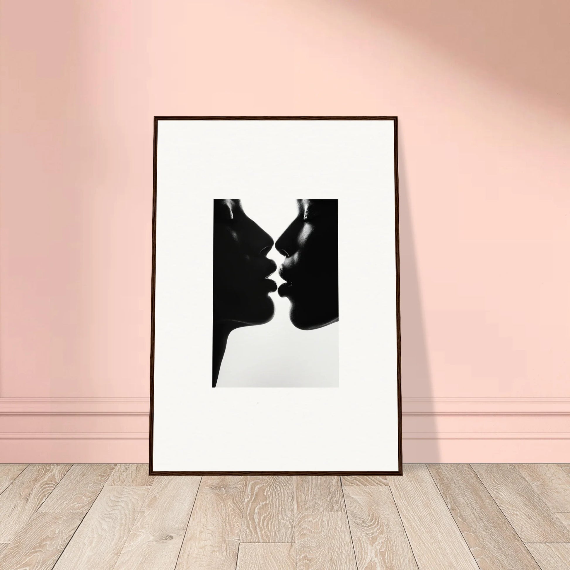 Black and white silhouette of two profiles about to kiss from Luminous Midnight Kiss framed art