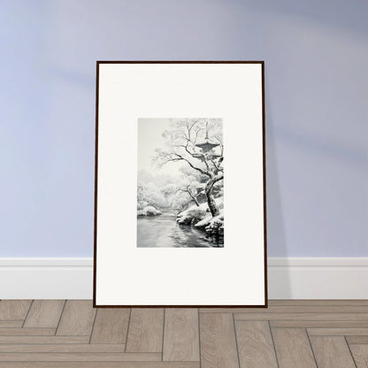 Framed black and white artwork of a winter tree by a river from Timeless Snow Fables