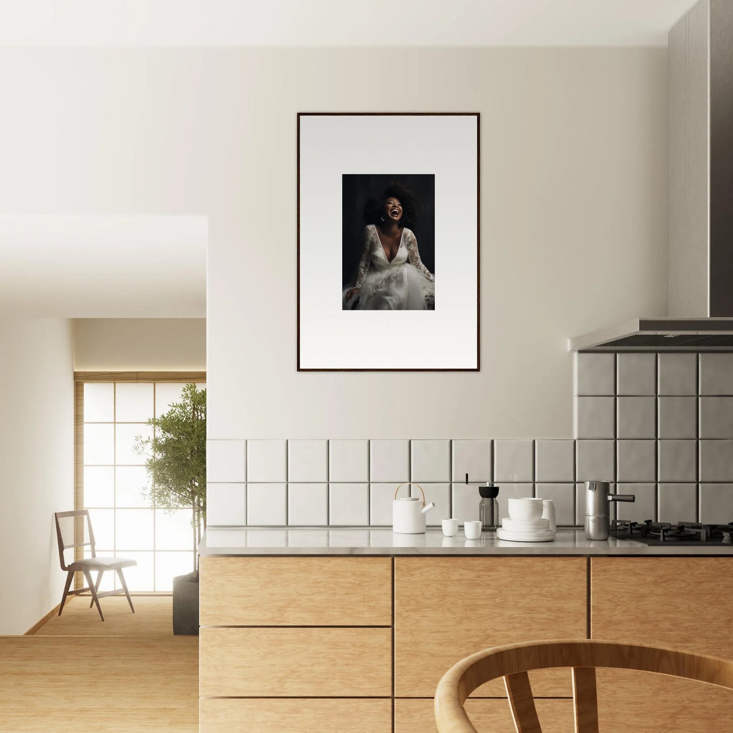 Framed black and white photograph on white wall showcasing Timeless Essence Laughter art