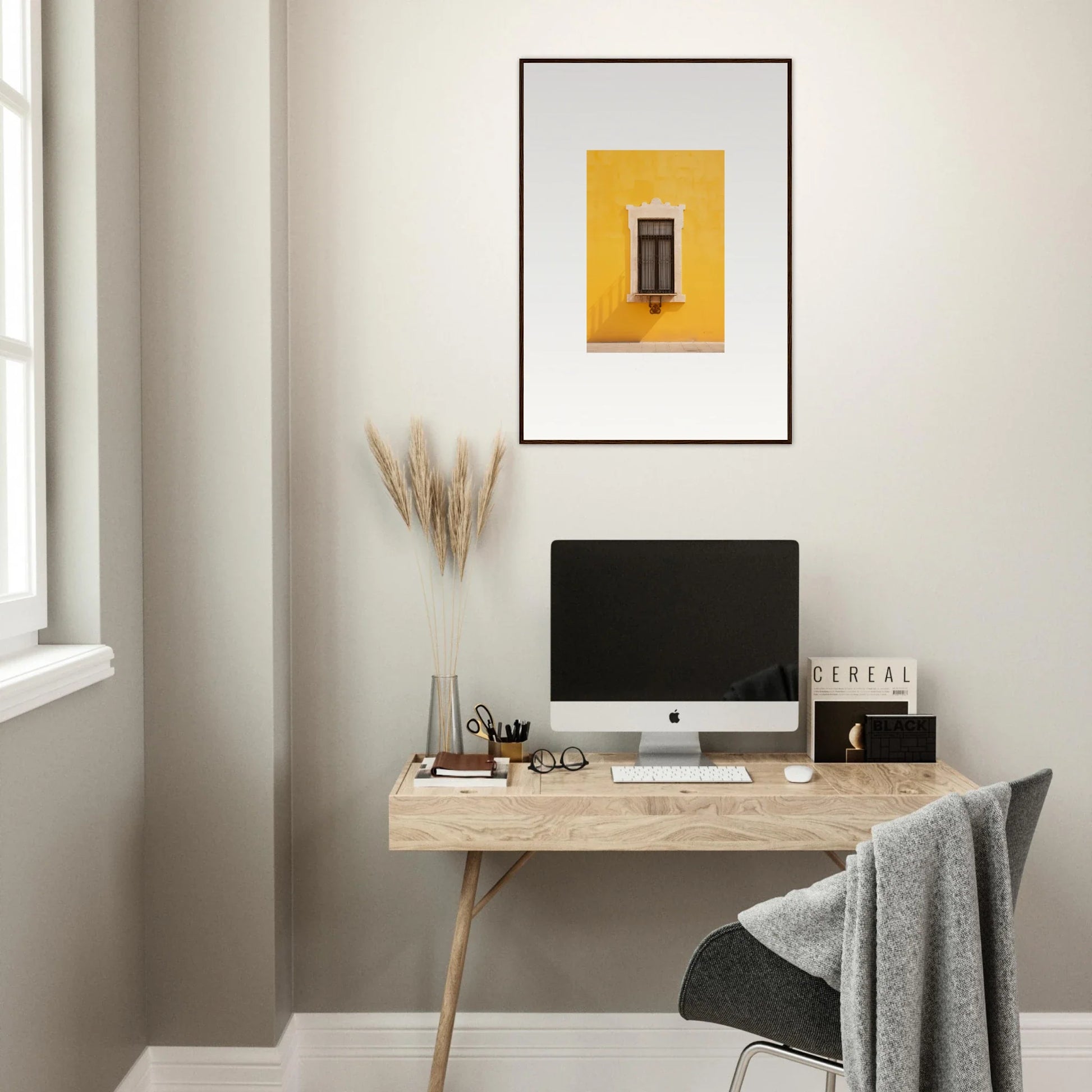 Minimalist wooden desk with iMac and yellow artwork in Window’s Giallo Reverie