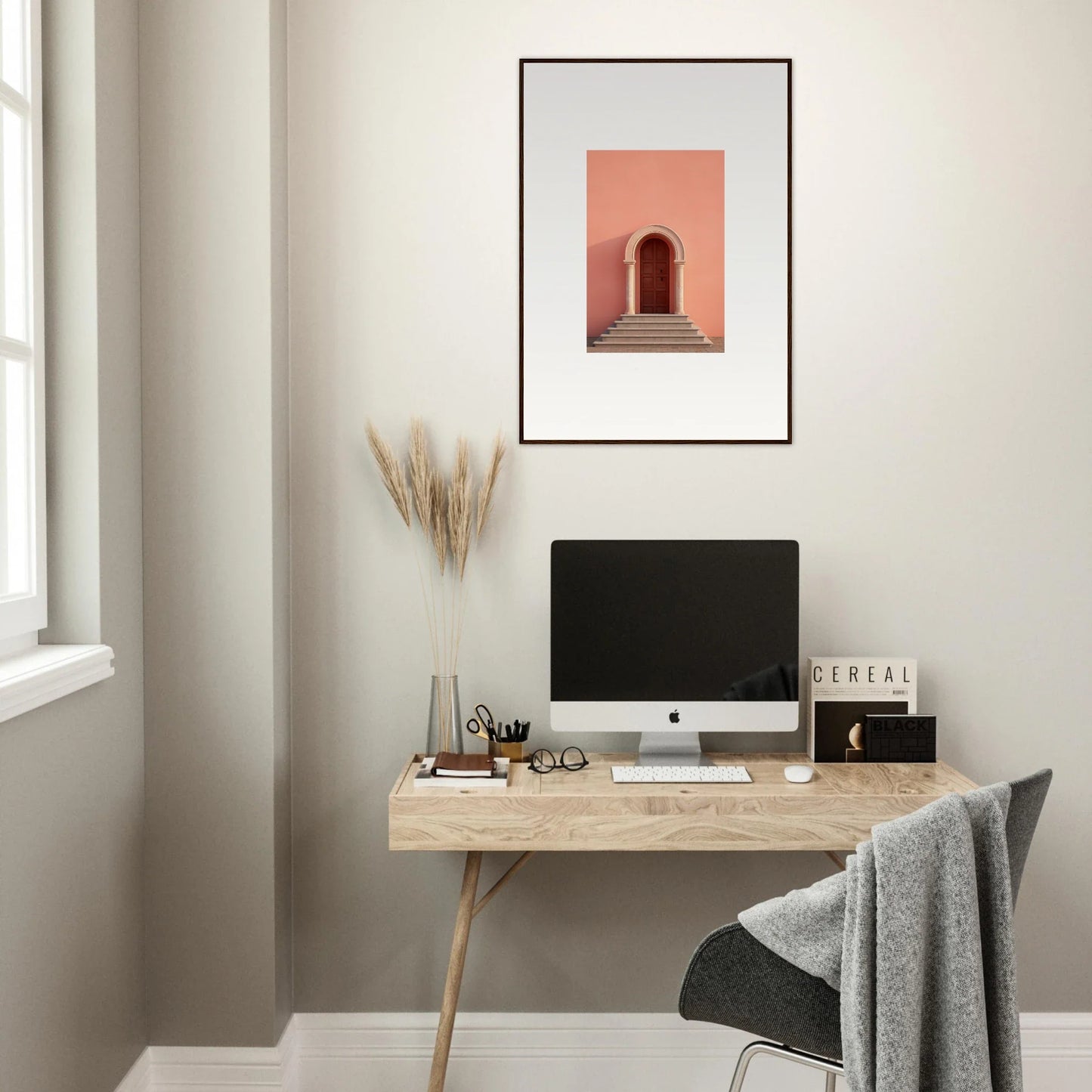 Minimalist wooden desk with an iMac, framed art, and Ethereal Sunset Gateway vibe