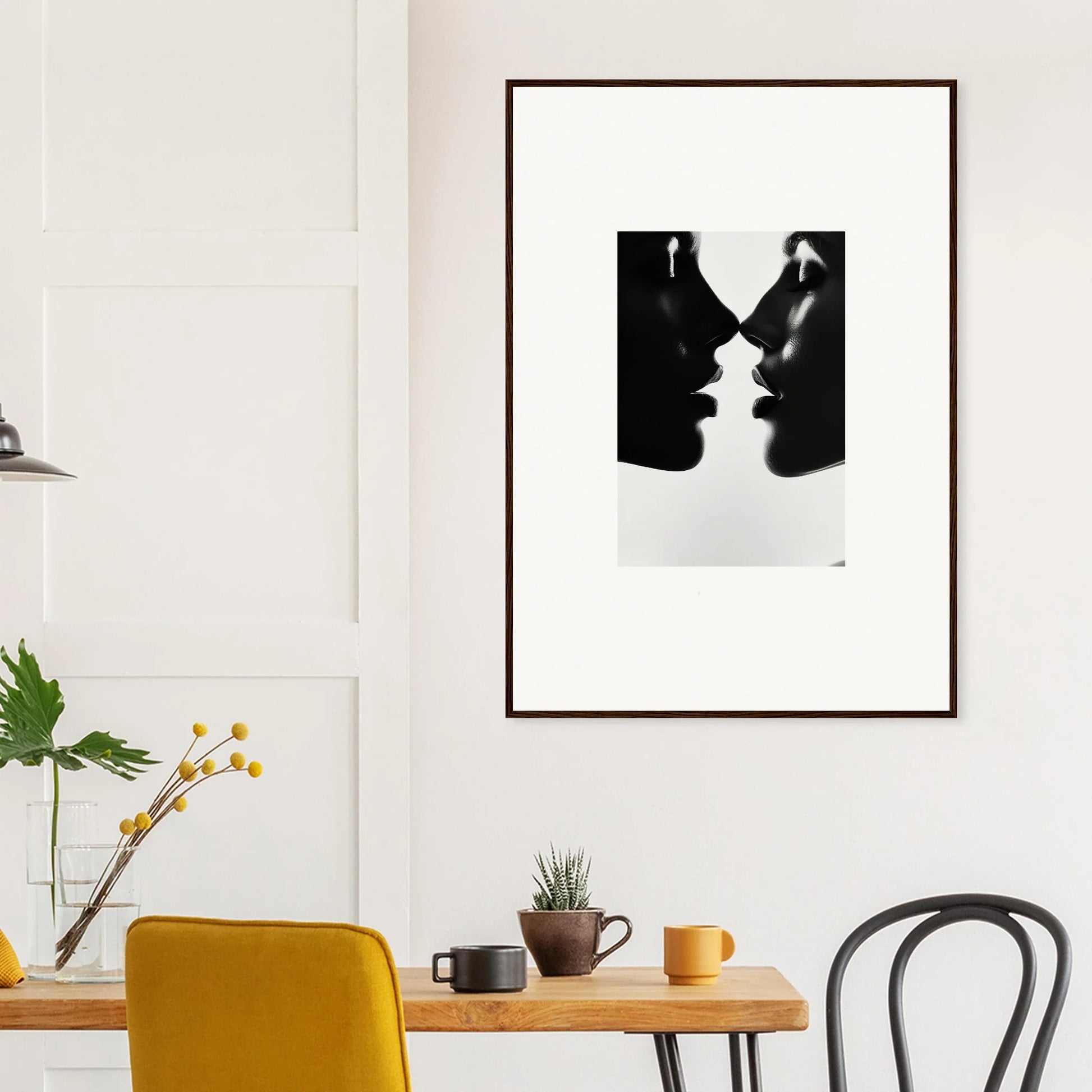 Black and white framed wall art of two silhouettes in Eclipsing Soulcare Kisses design