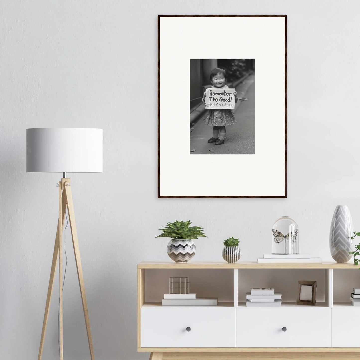 Framed black and white vintage photograph on light gray wall for Whimsy Echo Memory