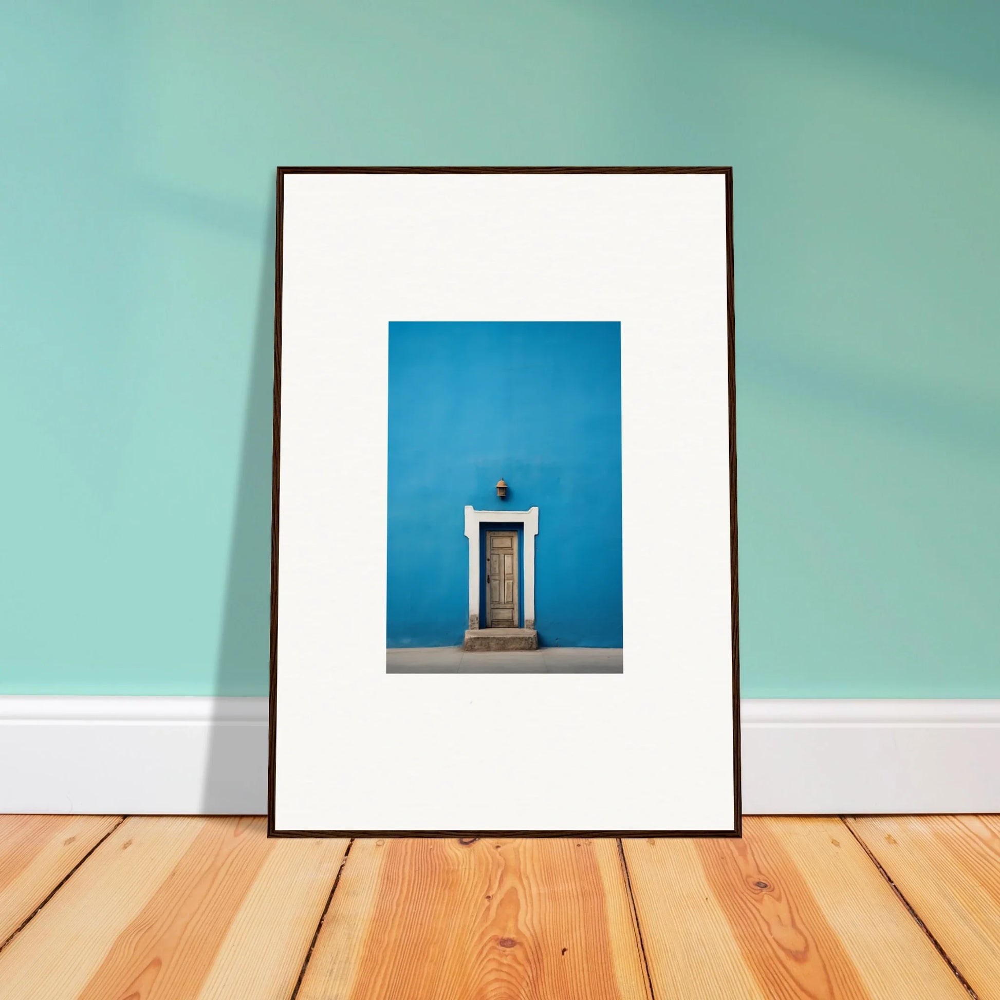 Framed photo of a wooden door on a bright blue wall from Eternal Cerulean Cloister