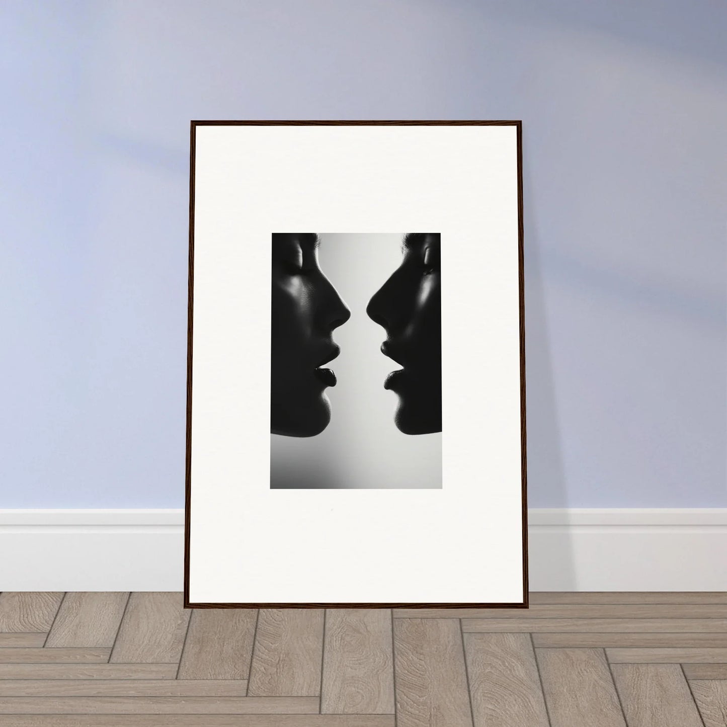 Framed black and white art of two silhouetted profiles for Symbiotic Echoes Flutter