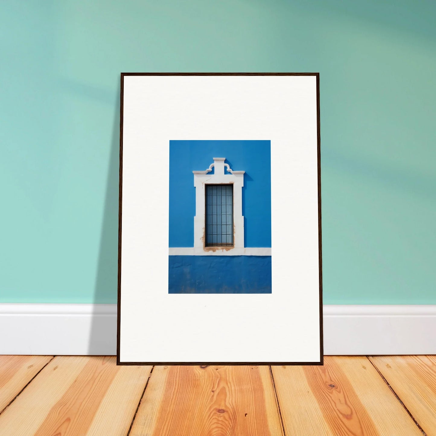 Framed wall art of a white-trimmed window on a Liquid Azure Quest blue wall