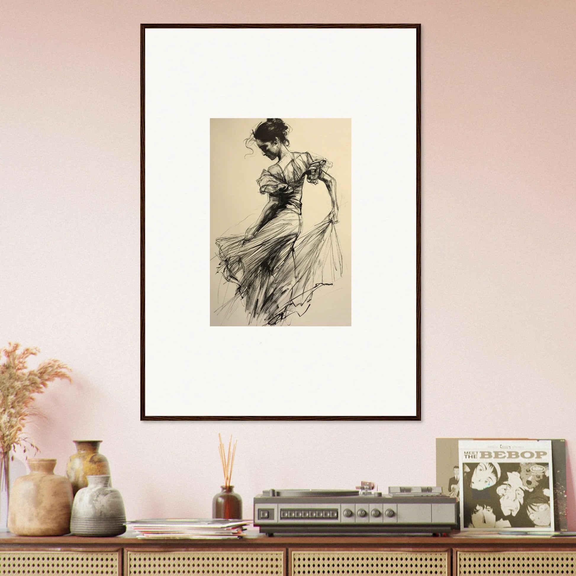 Framed wall art of a woman dancing in an ethereal pause beneath a vintage sketch