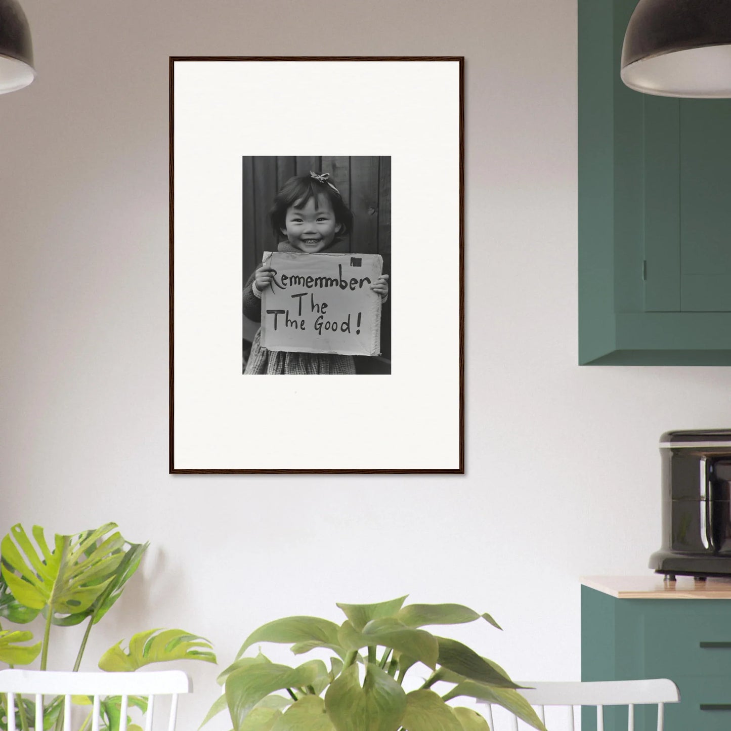 Framed black and white photo of a person with a sign from Timeless Joy Parade