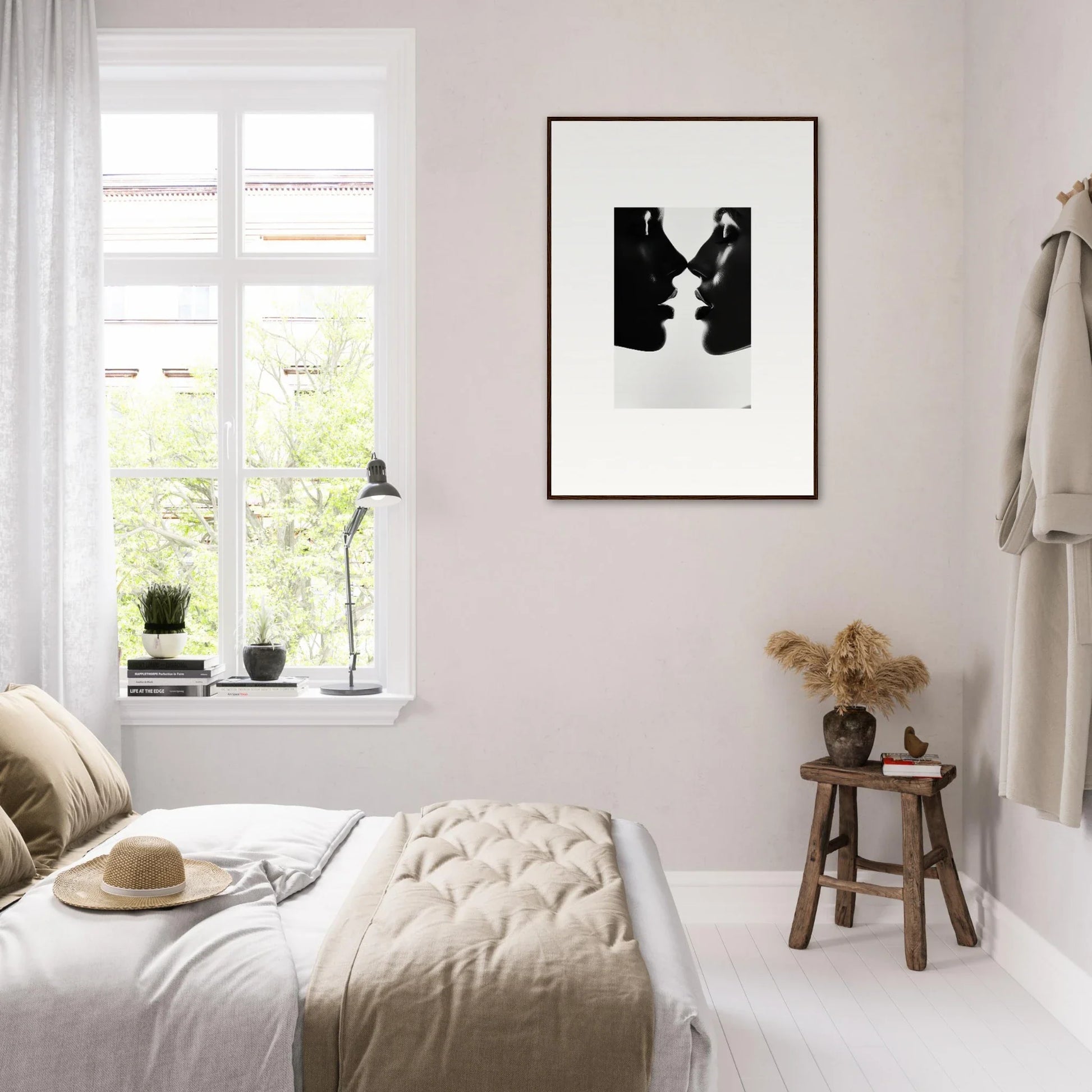 Minimalist bedroom with pale pink walls, showcasing Eclipsing Soulcare Kisses art