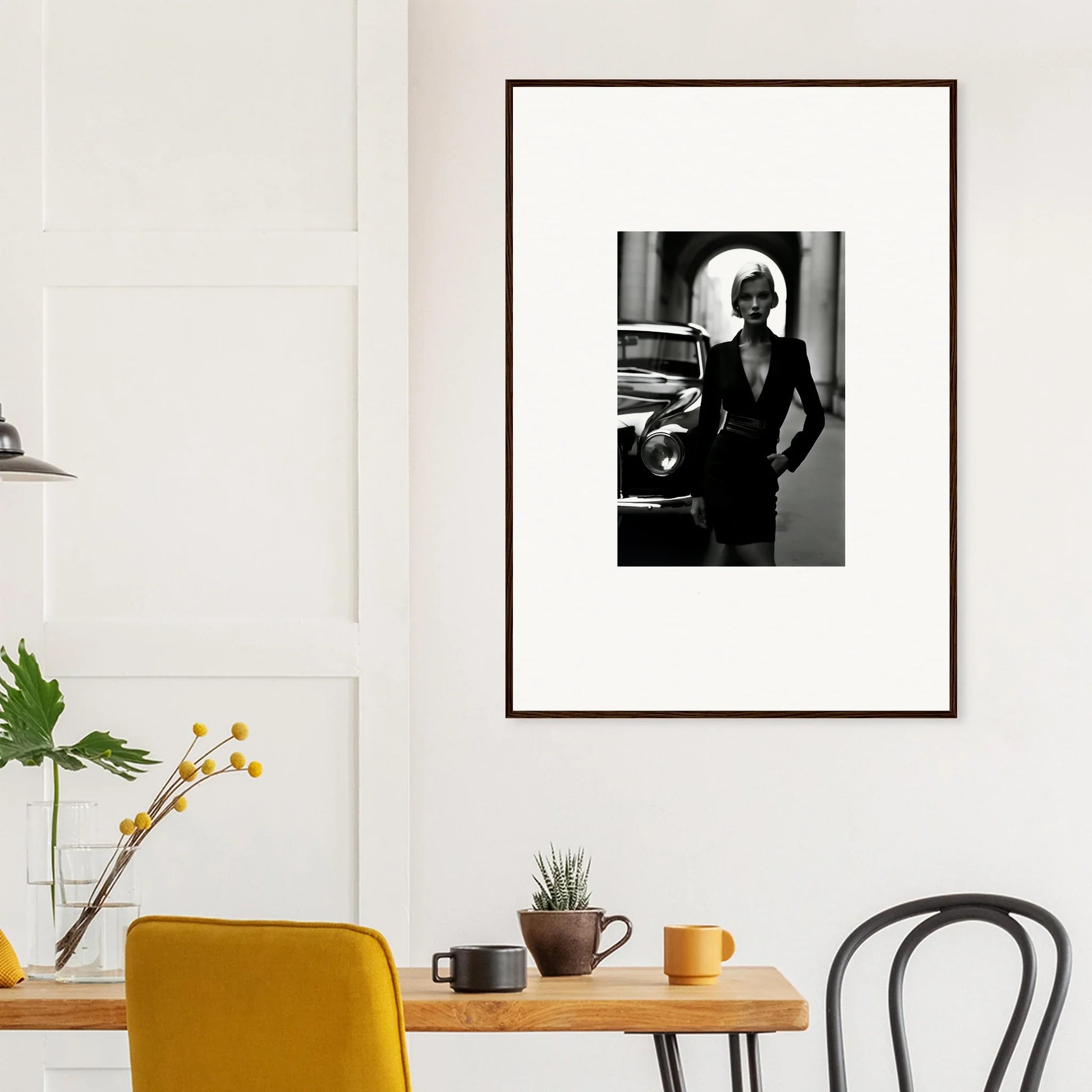 Framed black and white photo on a white wall featuring Interstellar Noir Illuminations