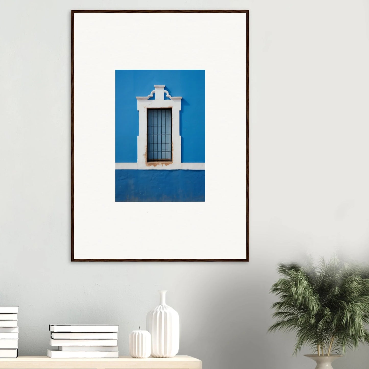 Framed wall art of a white-trimmed window on a bright blue wall from Liquid Azure Quest