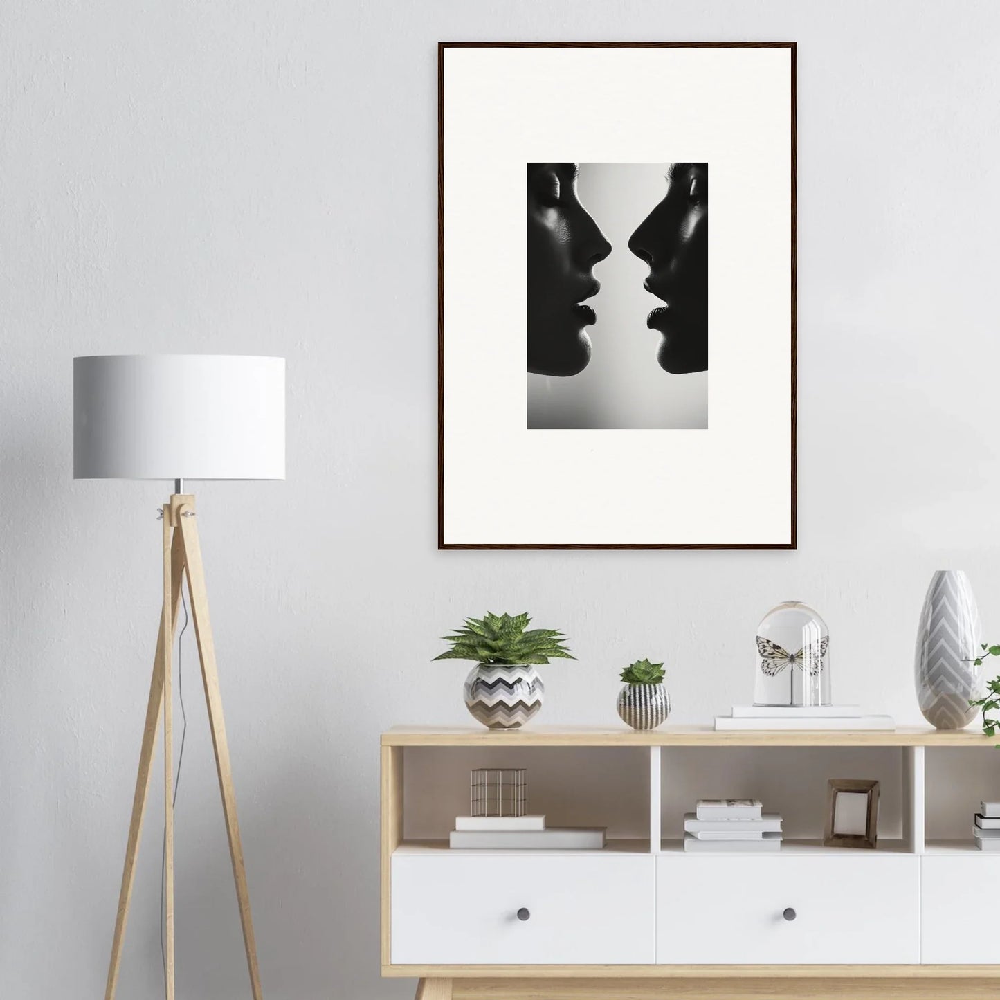 Black and white silhouette artwork of two profiles for Echo’s Embrace premium framed wall