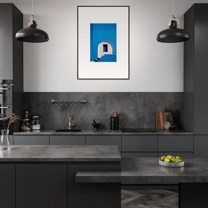 Modern dark gray kitchen with industrial lights and vibrant framed wall art from Doorway of Dreams