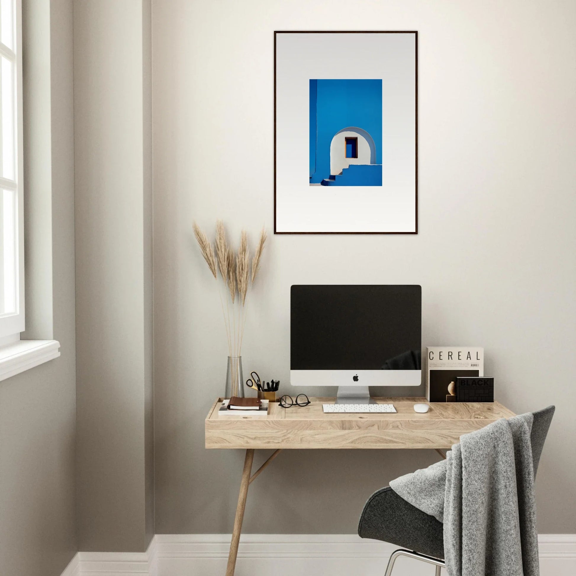 Minimalist wooden desk with iMac and Doorway of Dreams special edition art™ above