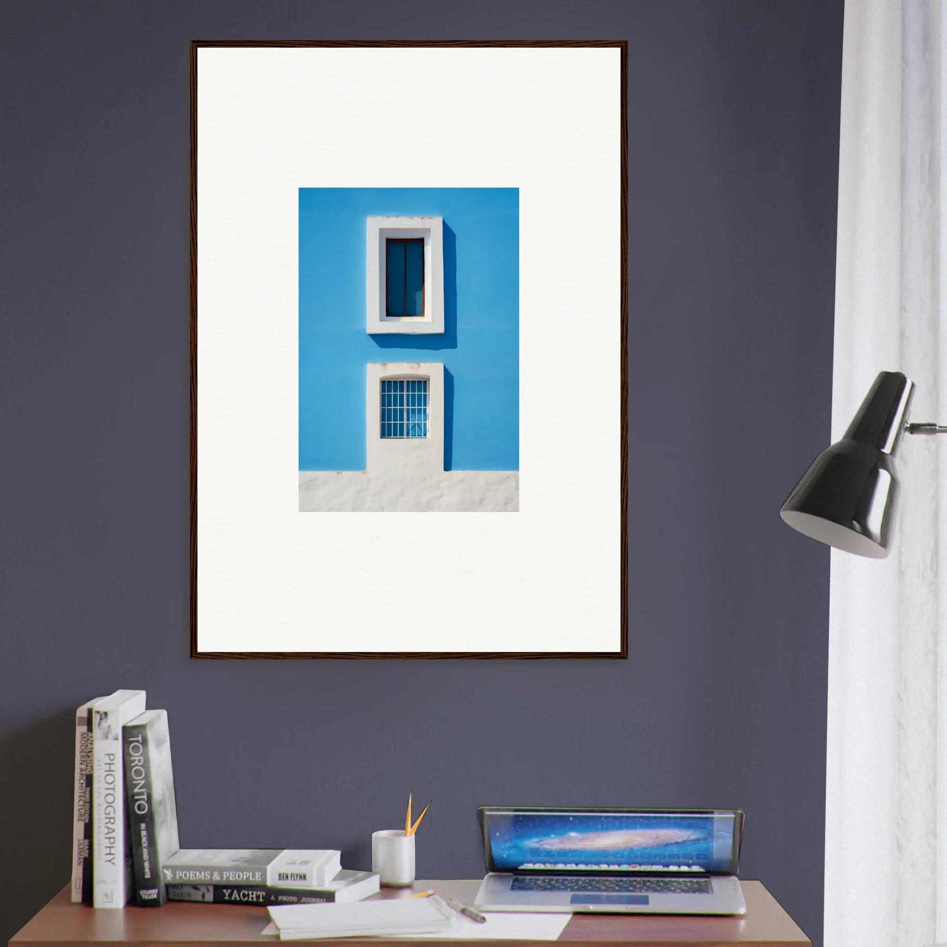 Framed wall art of white window and grate on blue wall in Isles Encompassed Vista